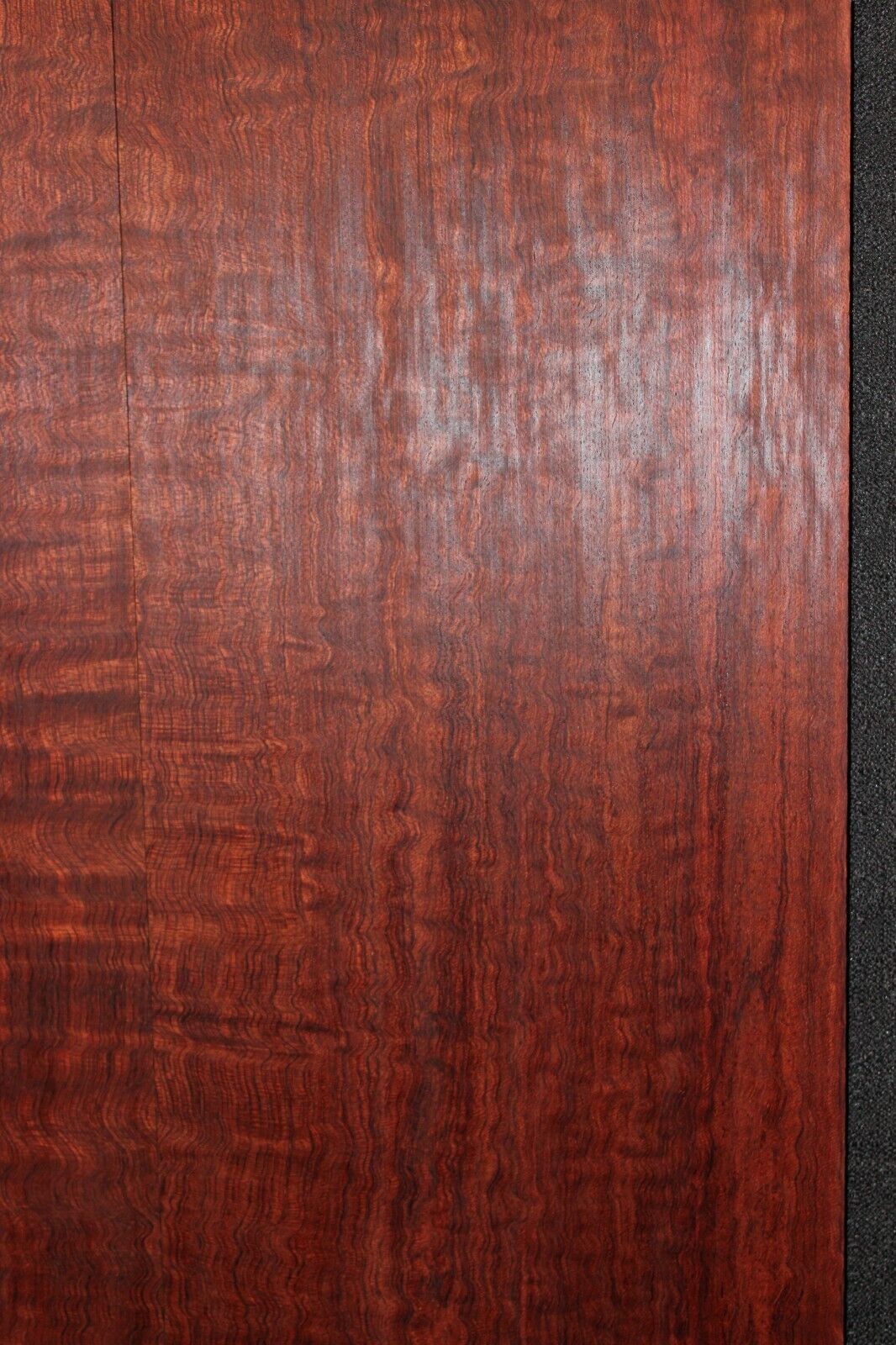 Figured bubinga electric guitar drop top. Curly / pomelle figure & rich color.