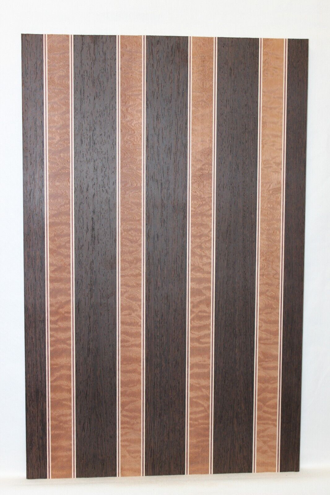 Quilted sapele, wenge, maple and purple-heart laminated electric guitar top.