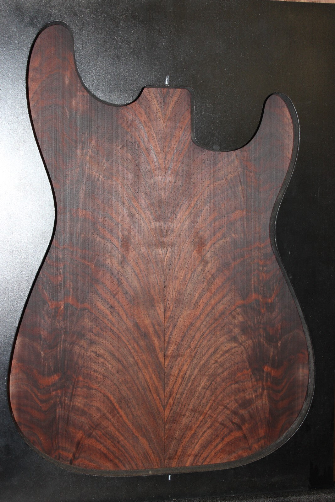 Black walnut crotch figured book matched guitar top.
