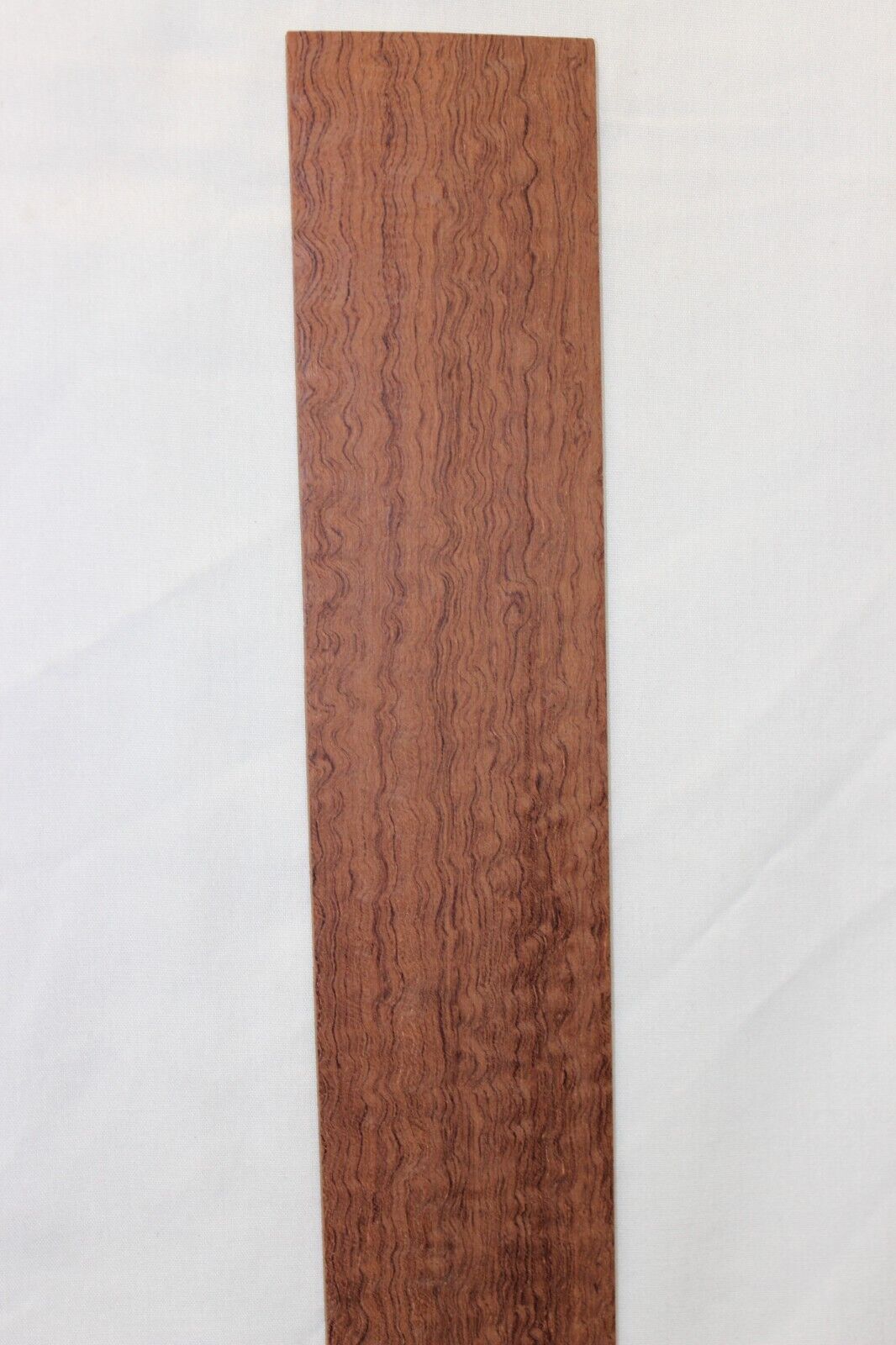 12 inch radius figured bubinga guitar fingerboard blank.