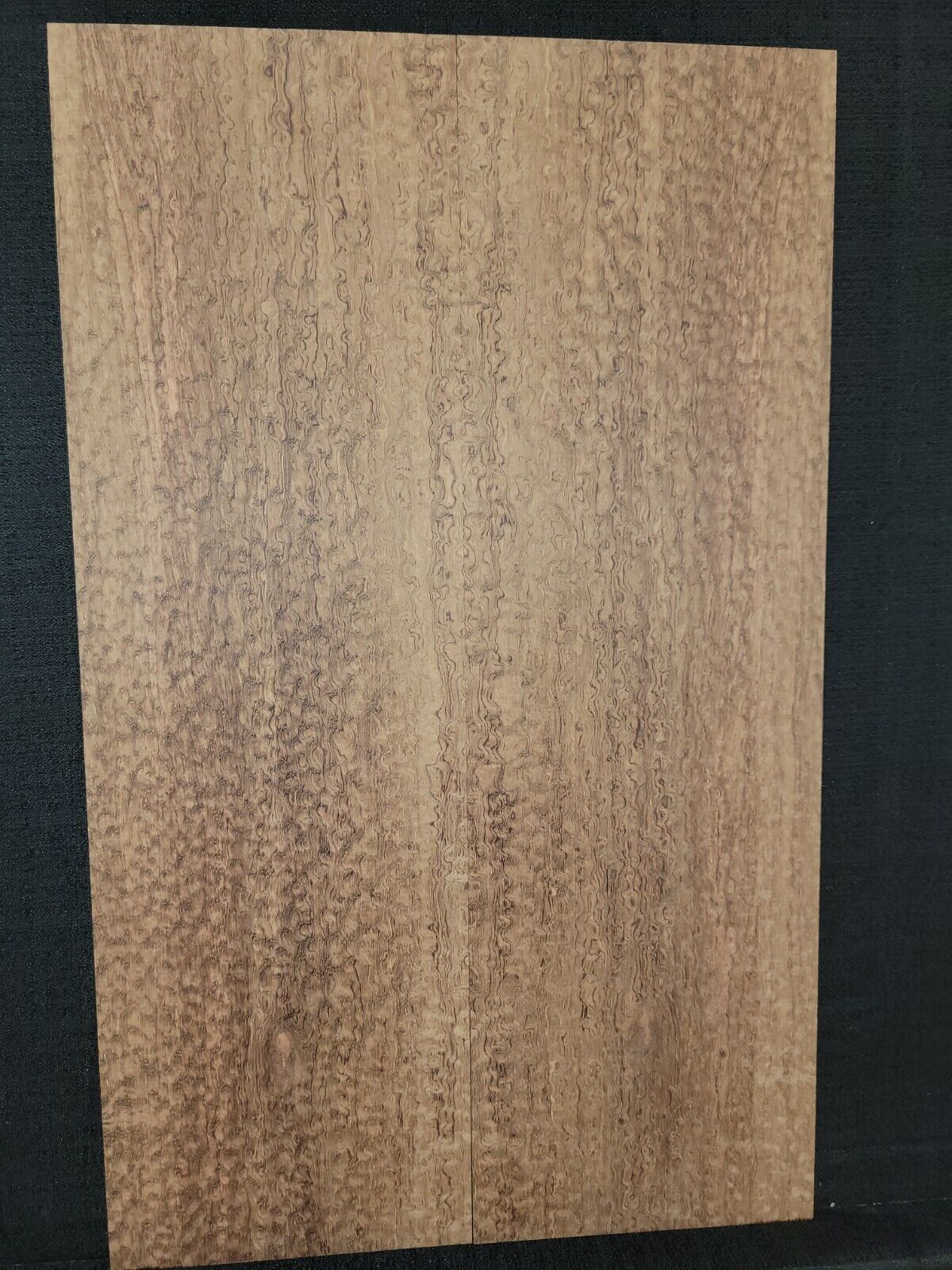 Pomelle figured bubinga electric guitar drop top.