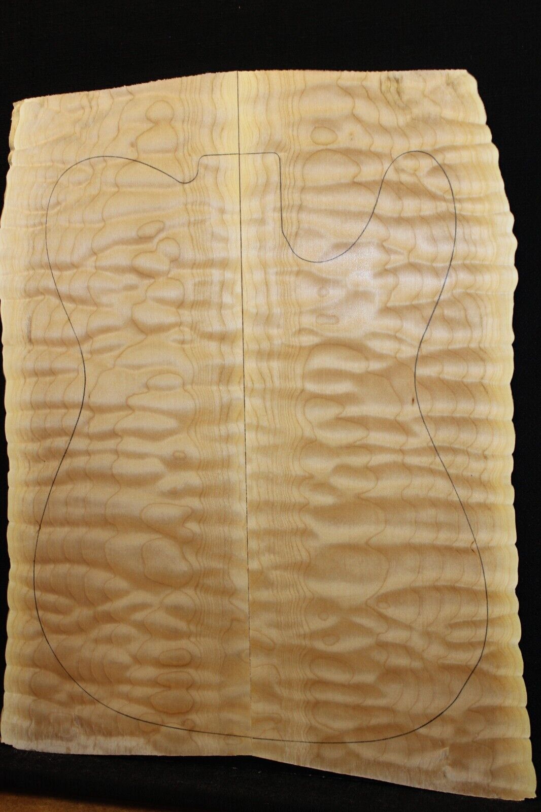 Quilted maple book matched guitar drop top. 5A figure, telly size