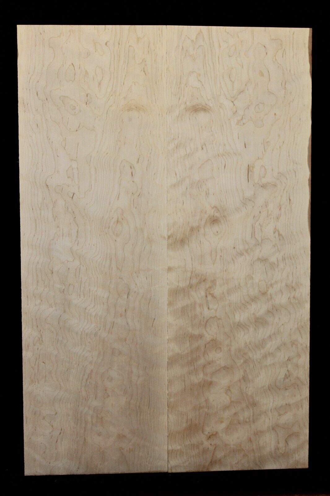 Figured eastern red maple guitar book matched top.