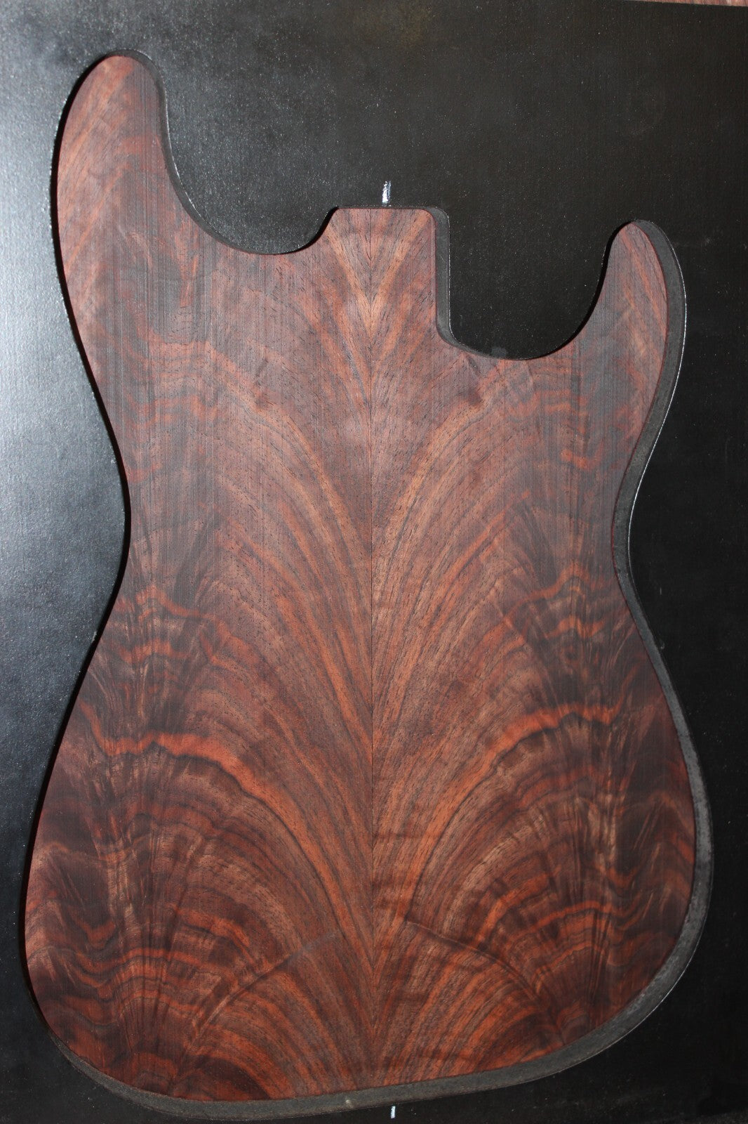 Black walnut crotch figured book matched guitar top.