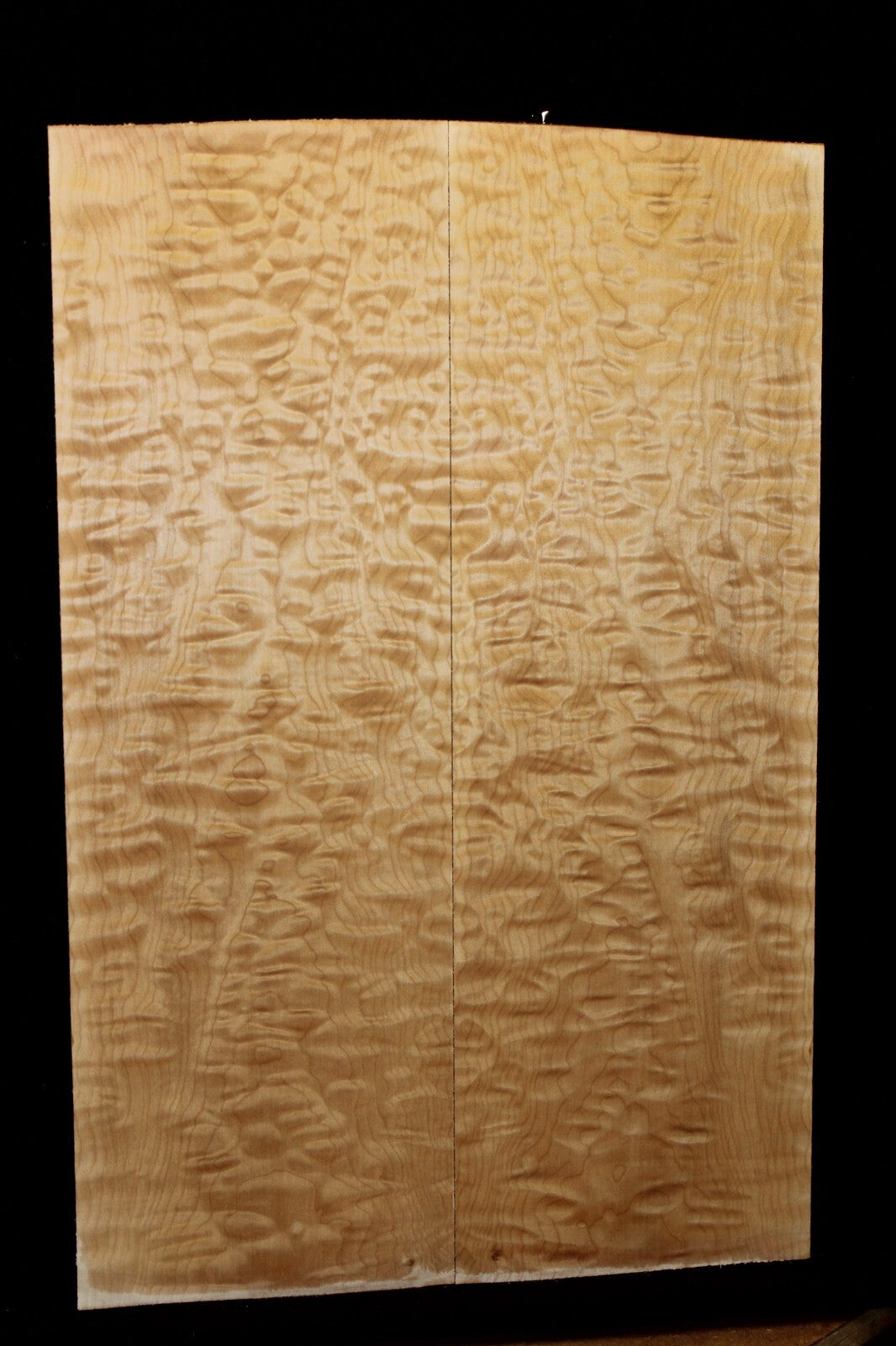 Quilted maple book matched guitar drop top.