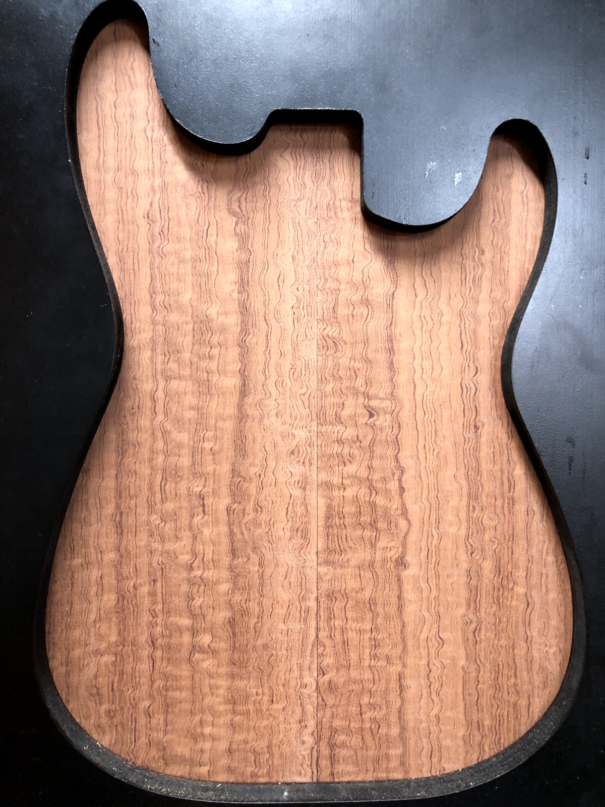 Figured quarter sawn bubinga guitar drop top.