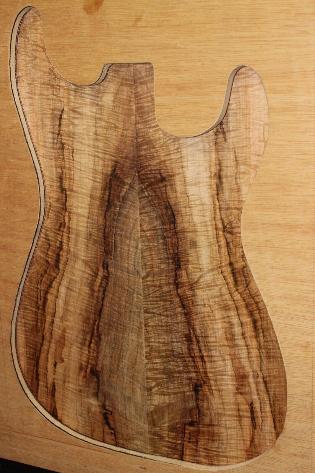 Figured ambrosia maple book matched guitar top, insane figure and color.