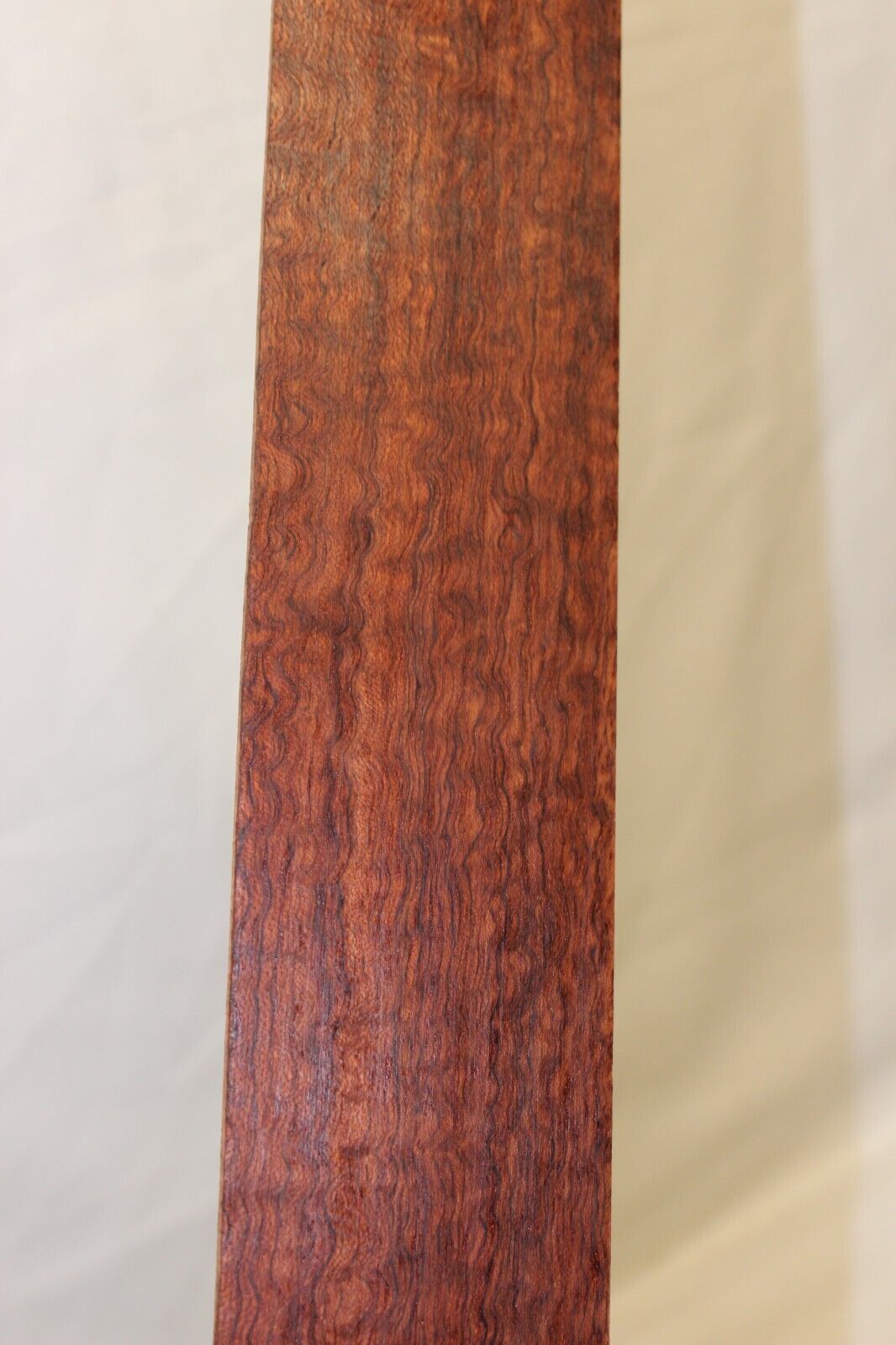 12 inch radius figured bubinga guitar fingerboard blank.