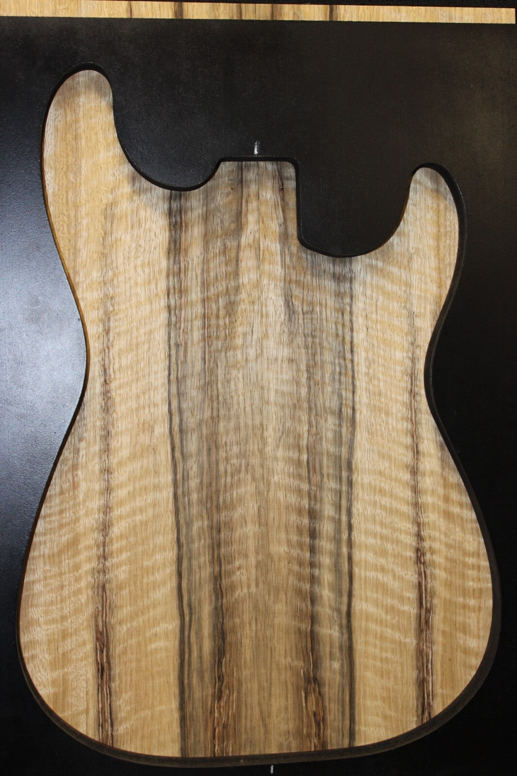Curly black limba / korina figured book matched guitar top. 0.37" thick