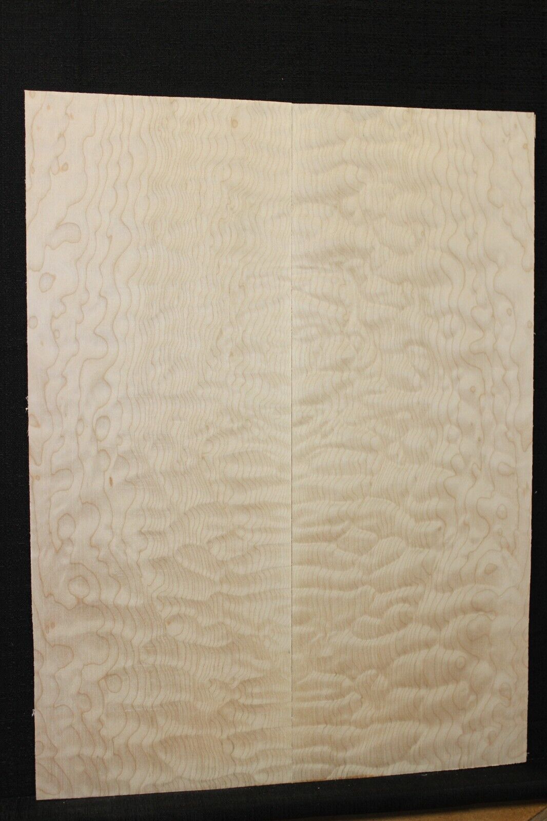 Quilted maple book matched guitar drop top.