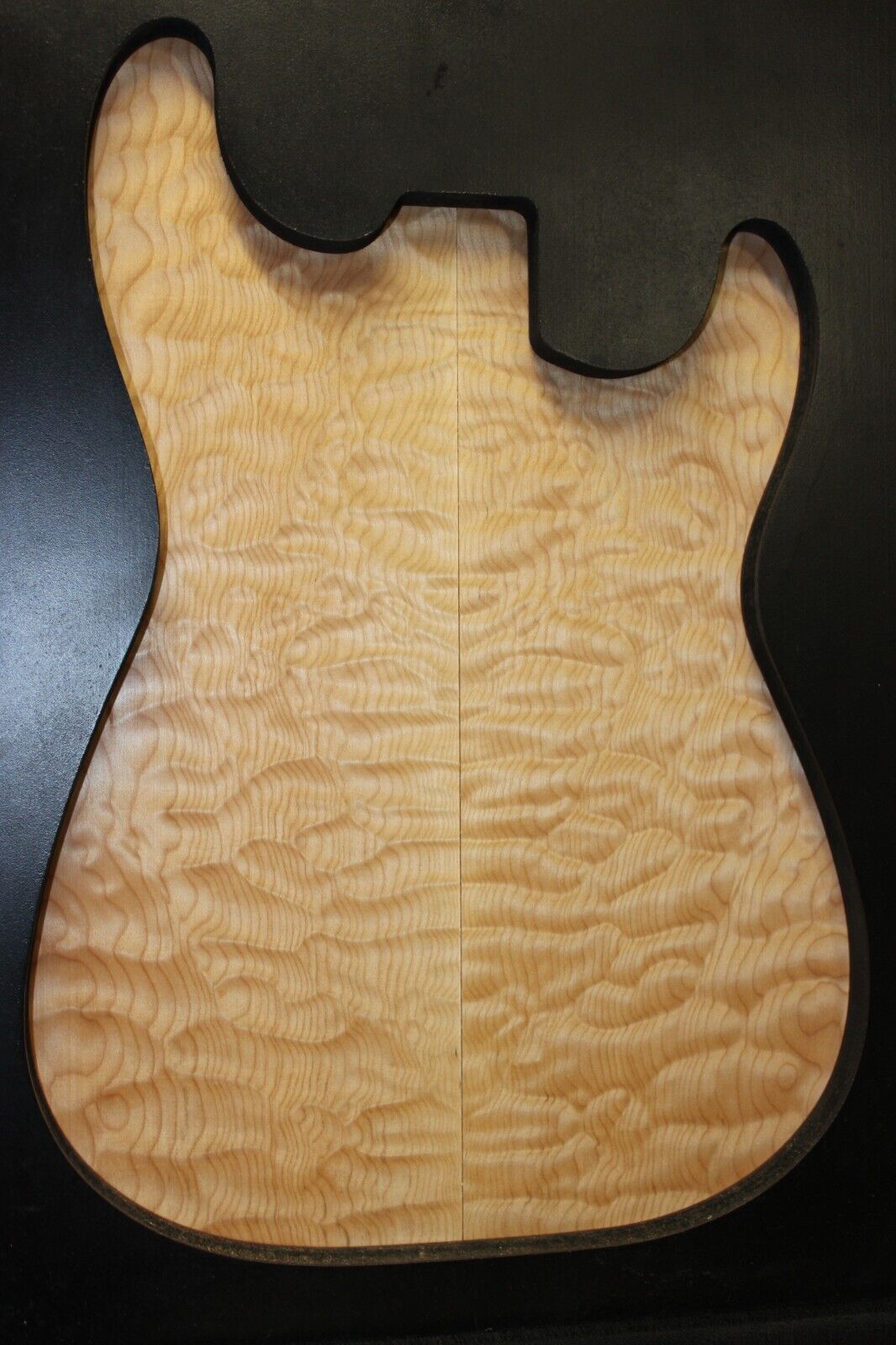 Quilted maple book matched guitar drop top.