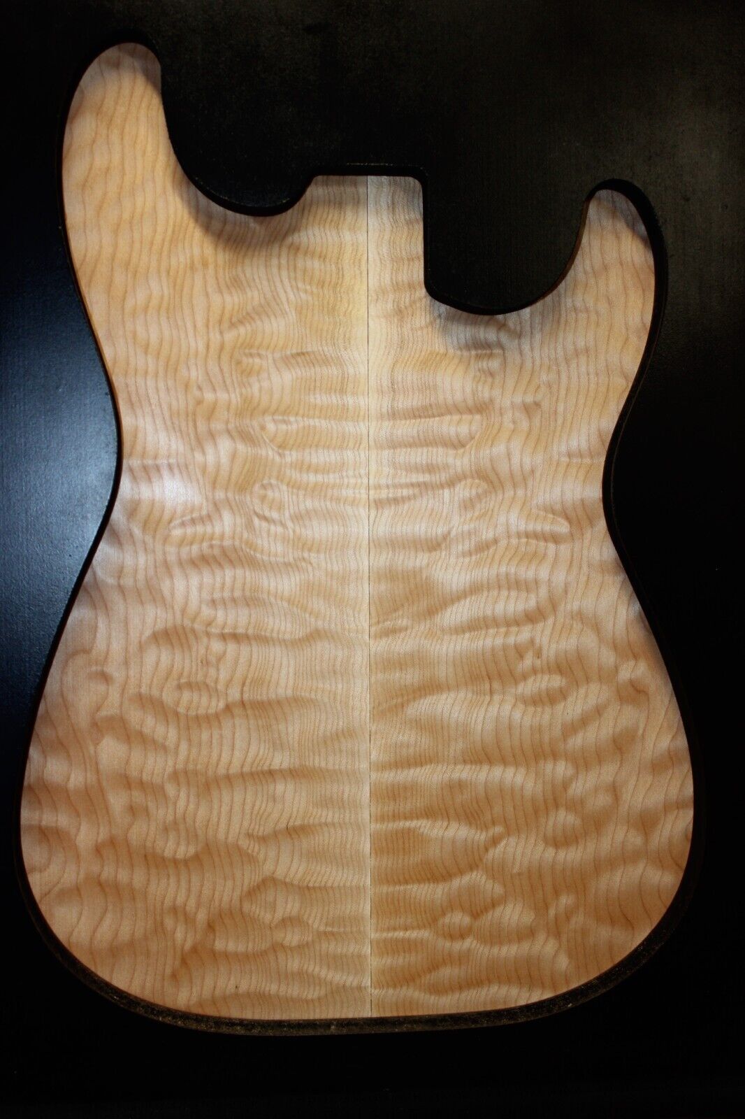 Quilted maple book matched guitar drop top.