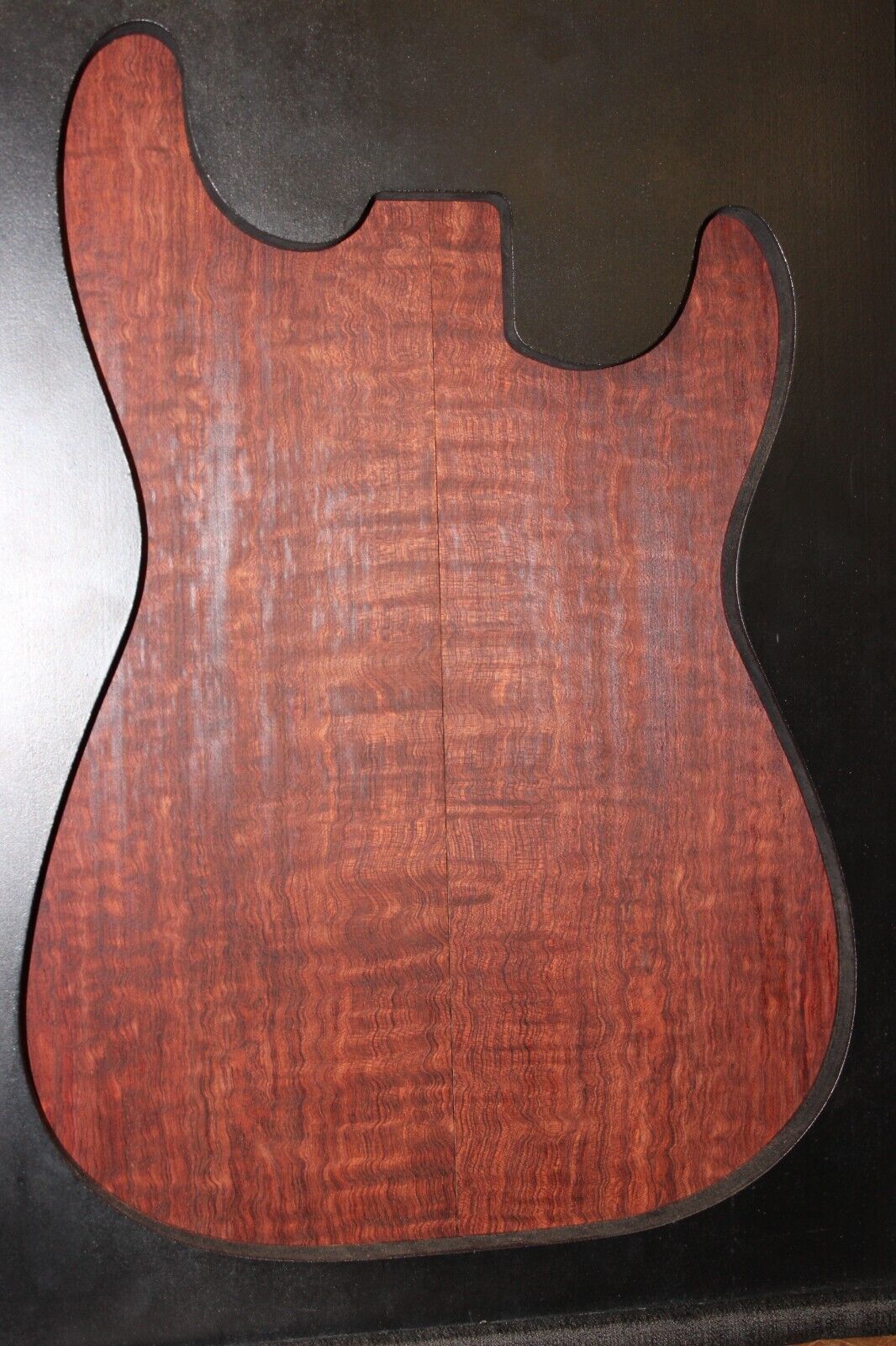 Figured bubinga electric guitar drop top. Curly / pomelle figure & rich color.