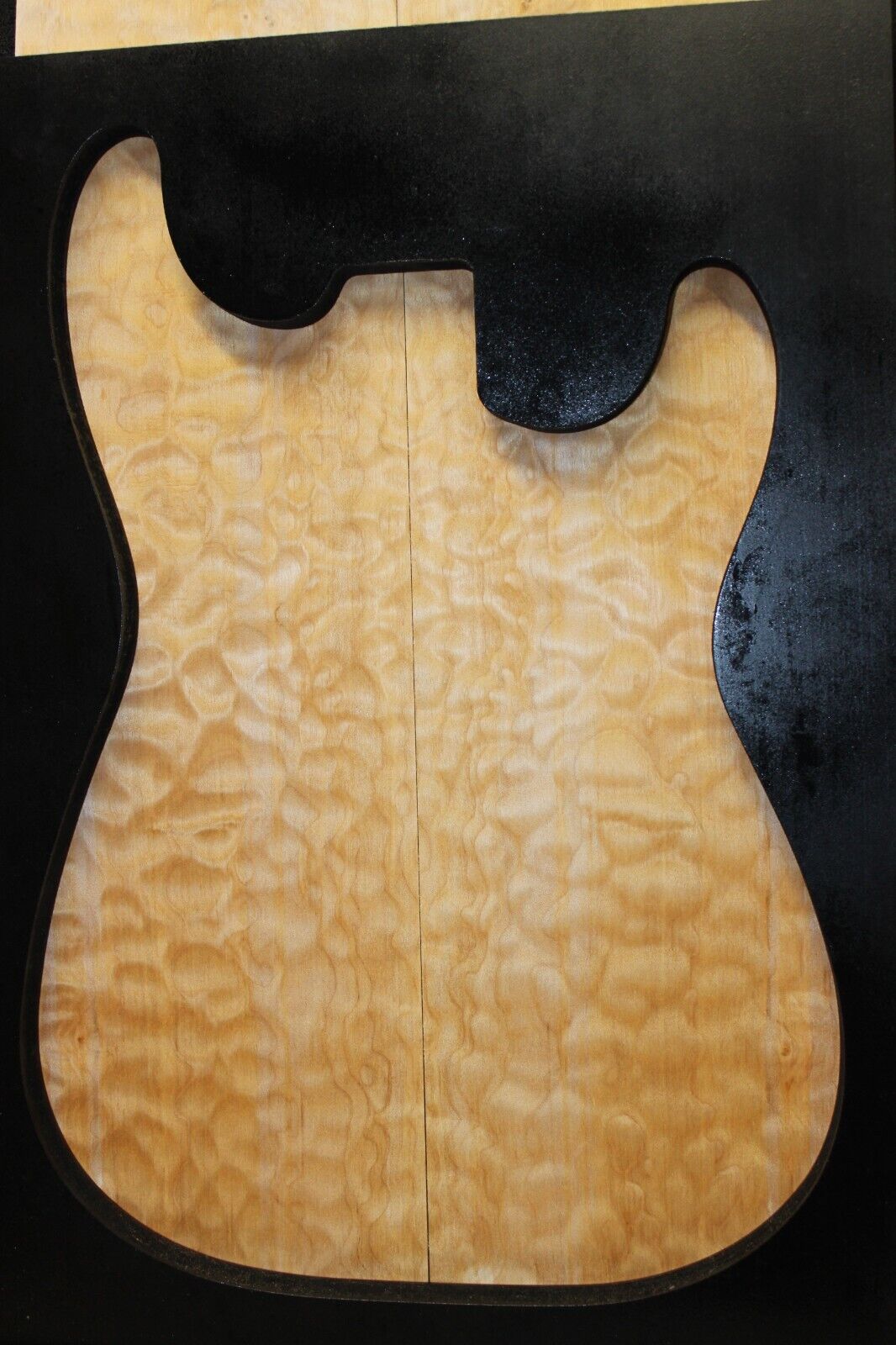 Quilted maple book matched guitar drop top.