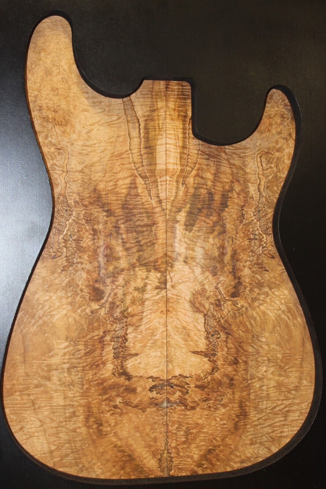Figured ambrosia maple bookmatched guitar top, insane figure and color.