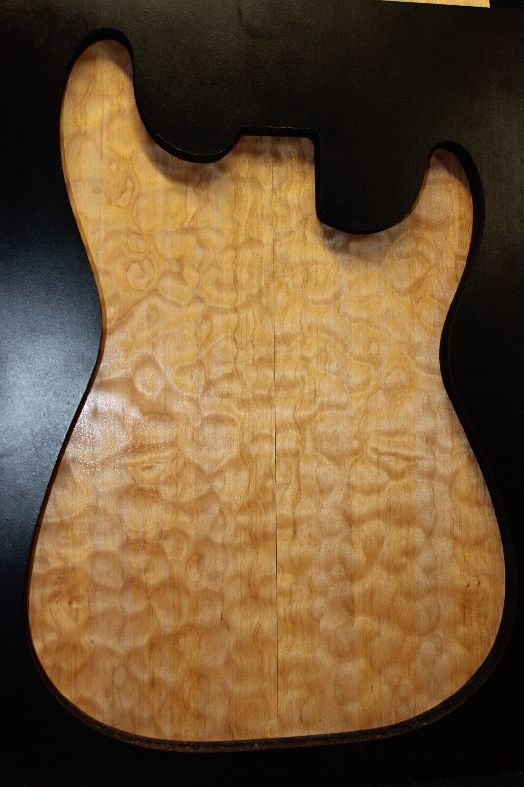 Quilted maple book matched guitar drop top.