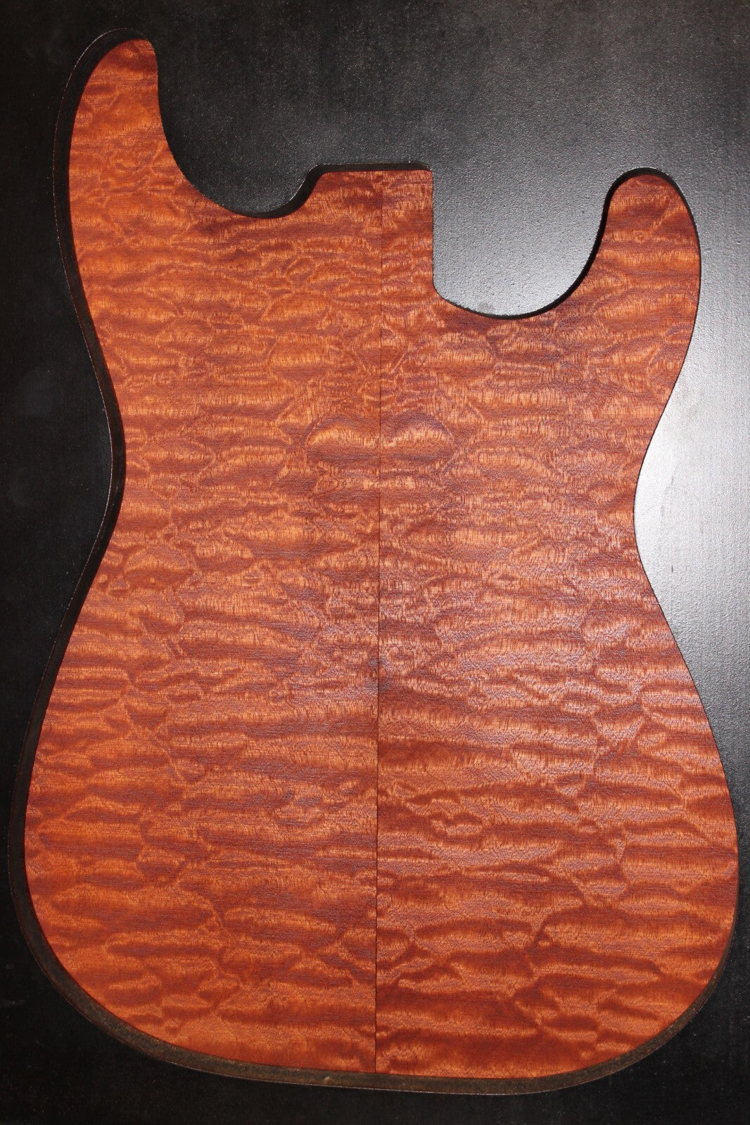 Quilted sapele electric guitar bookmatched drop top. Master grade figure.