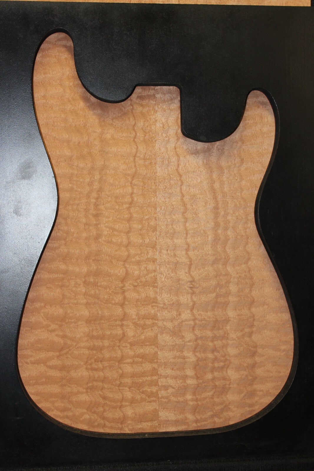 Quilted sapele electric guitar bookmatched drop top. Master grade figure.