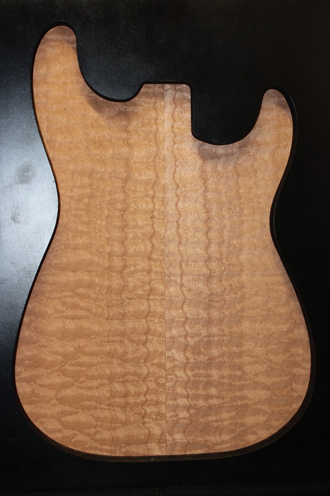 Quilted sapele electric guitar bookmatched drop top. Master grade figure.