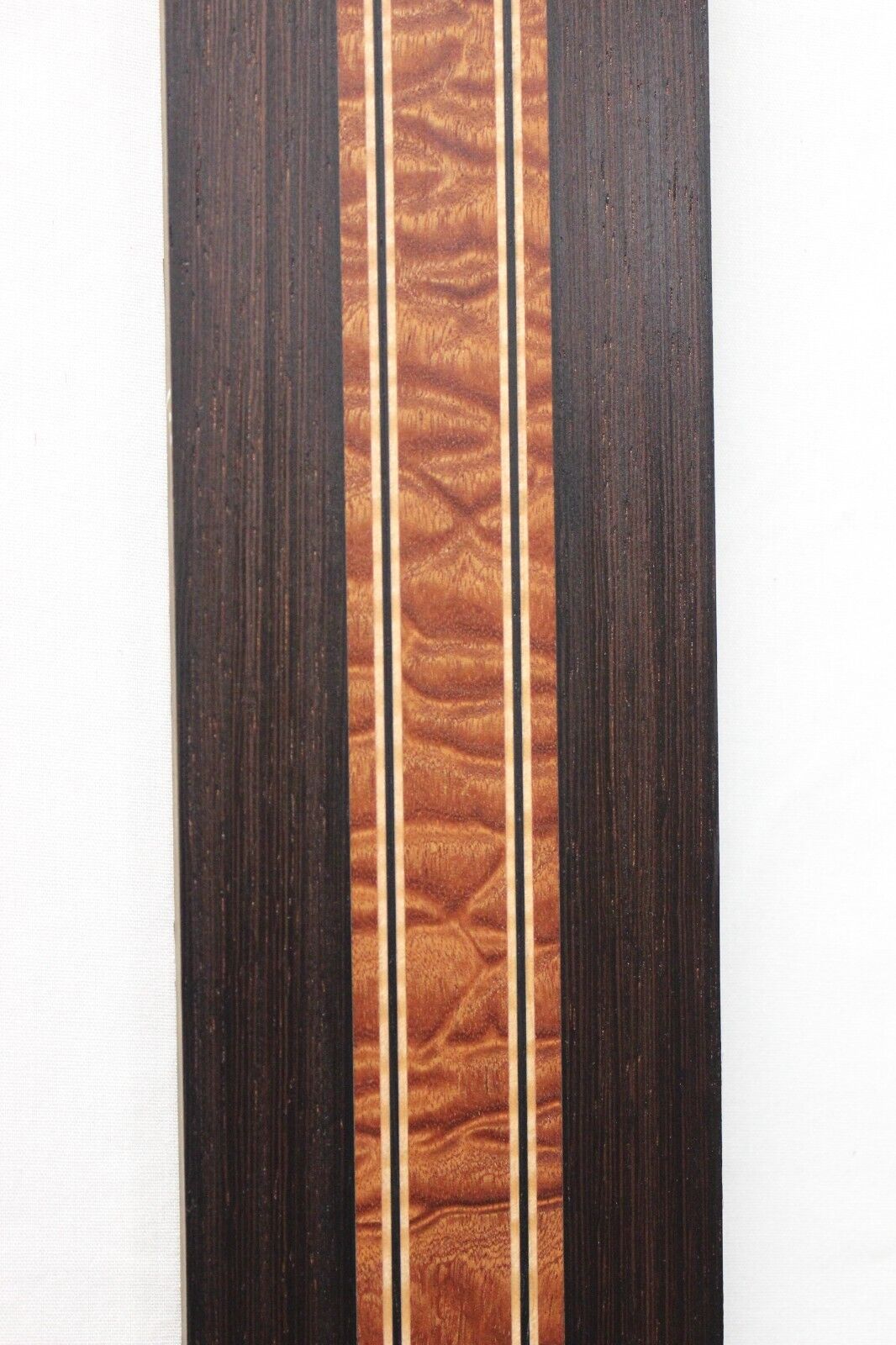 Quilted sapele, wenge and flame maple laminated guitar neck blank.