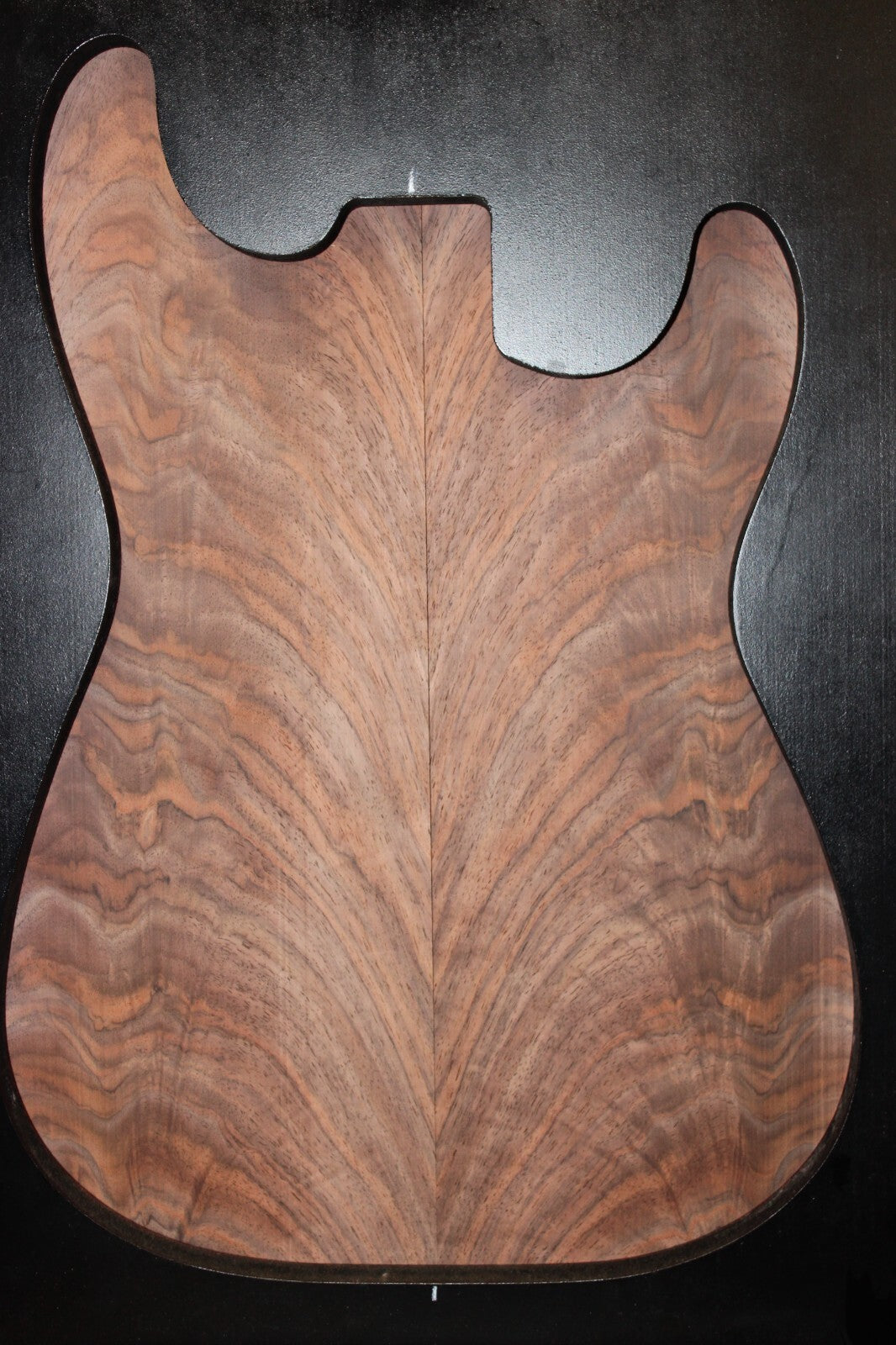 Black walnut crotch figured book matched guitar top.