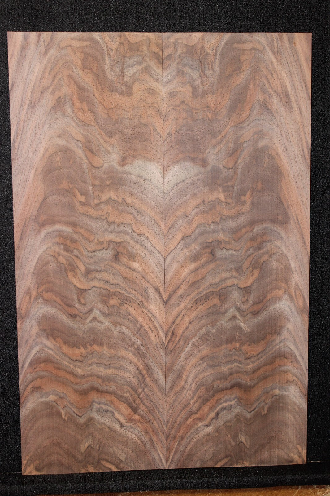 Black walnut crotch figured book matched guitar top.