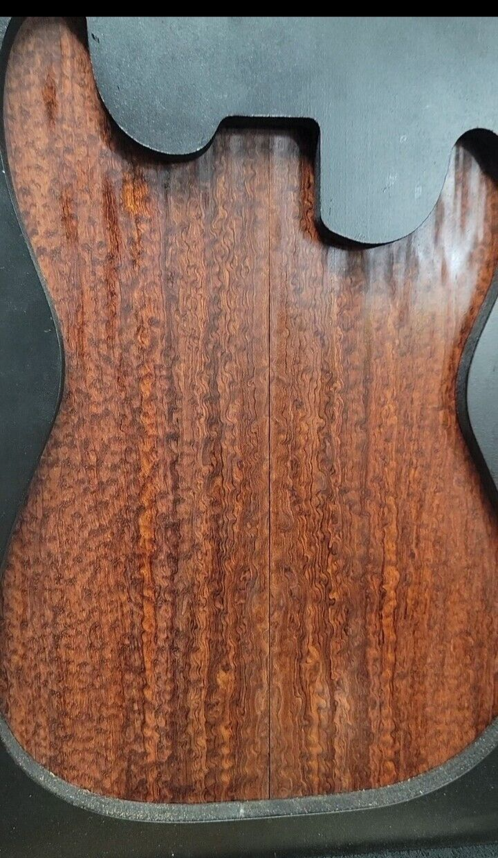 Pomelle figured bubinga electric guitar drop top.