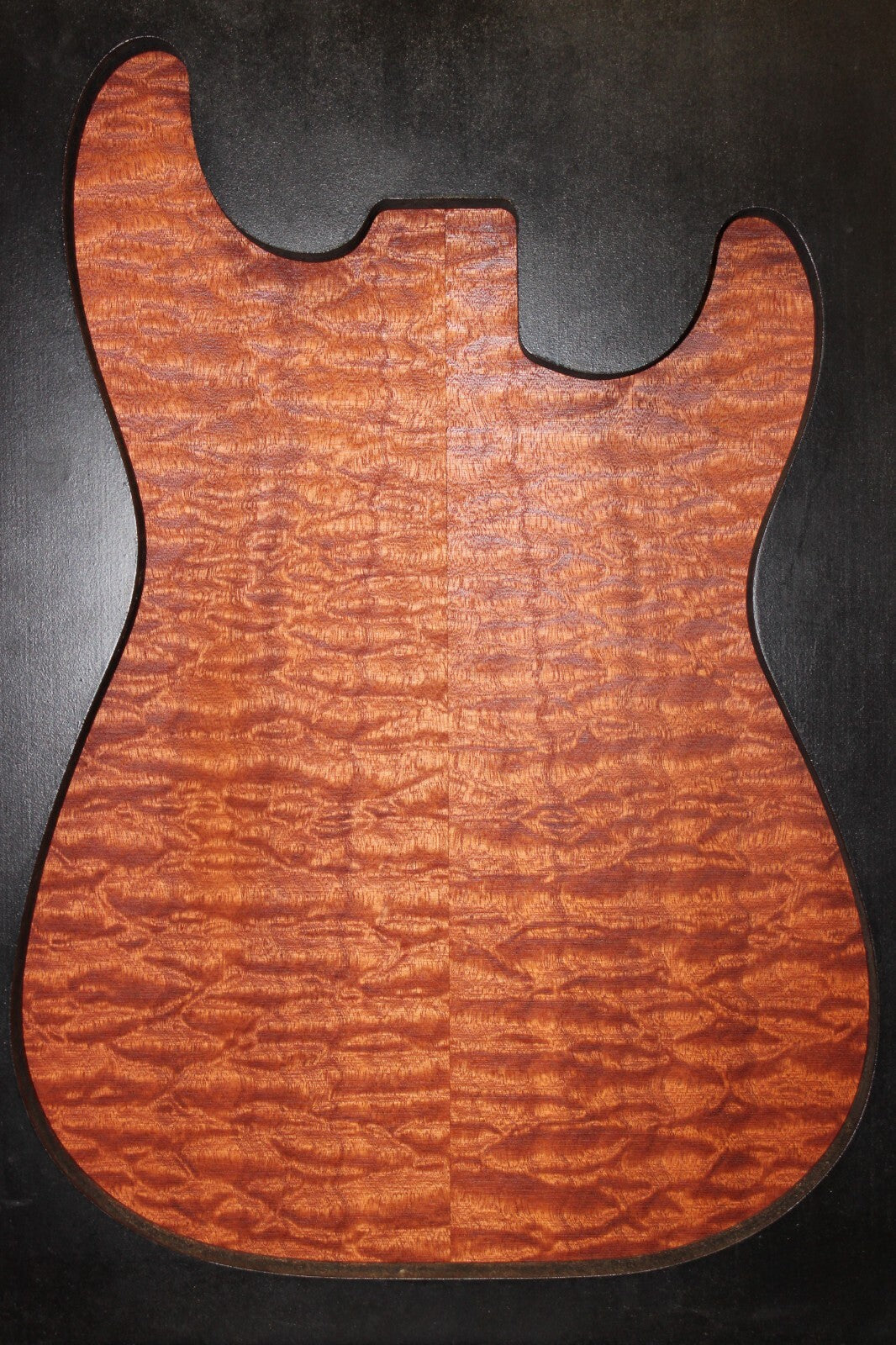 Quilted sapele electric guitar bookmatched drop top. Master grade figure.