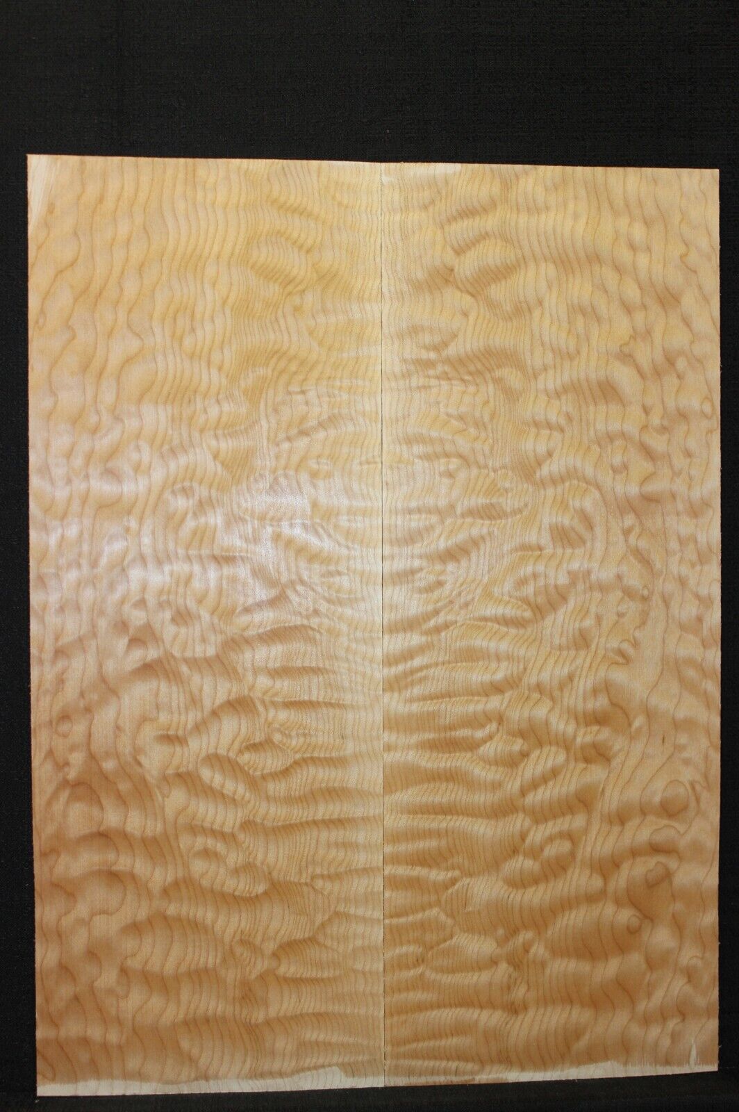 Quilted maple book matched guitar drop top.