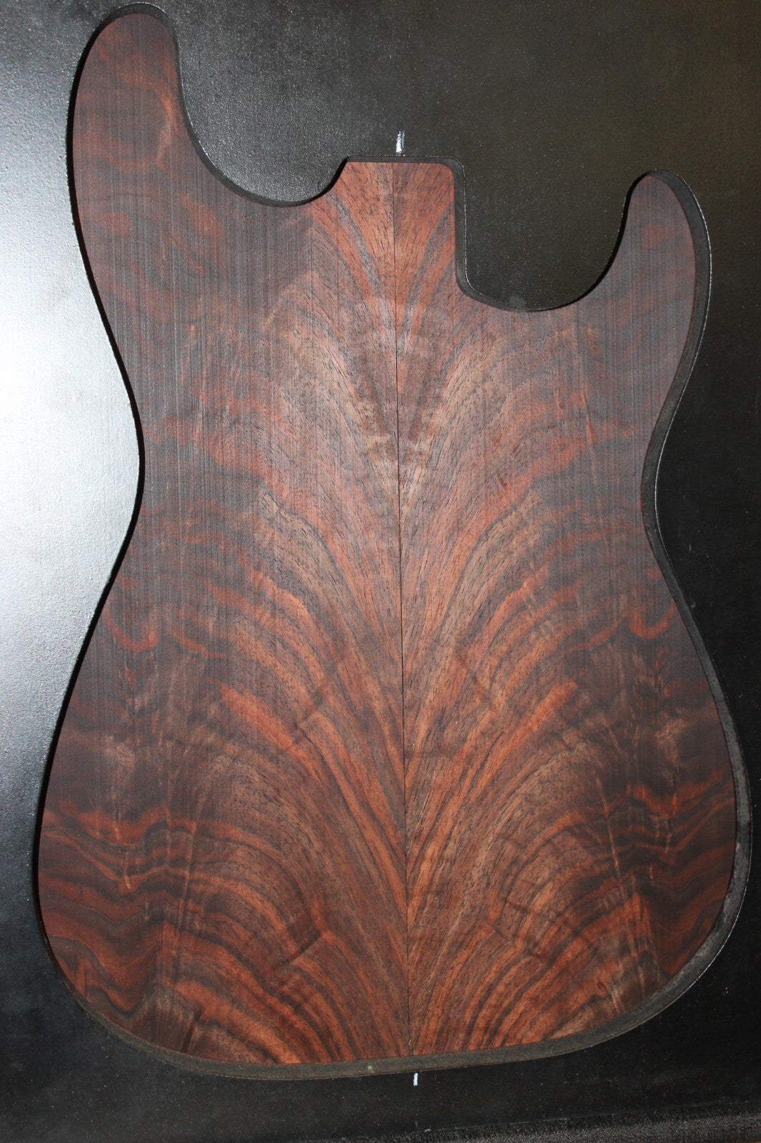 Black walnut crotch figured book matched guitar top.