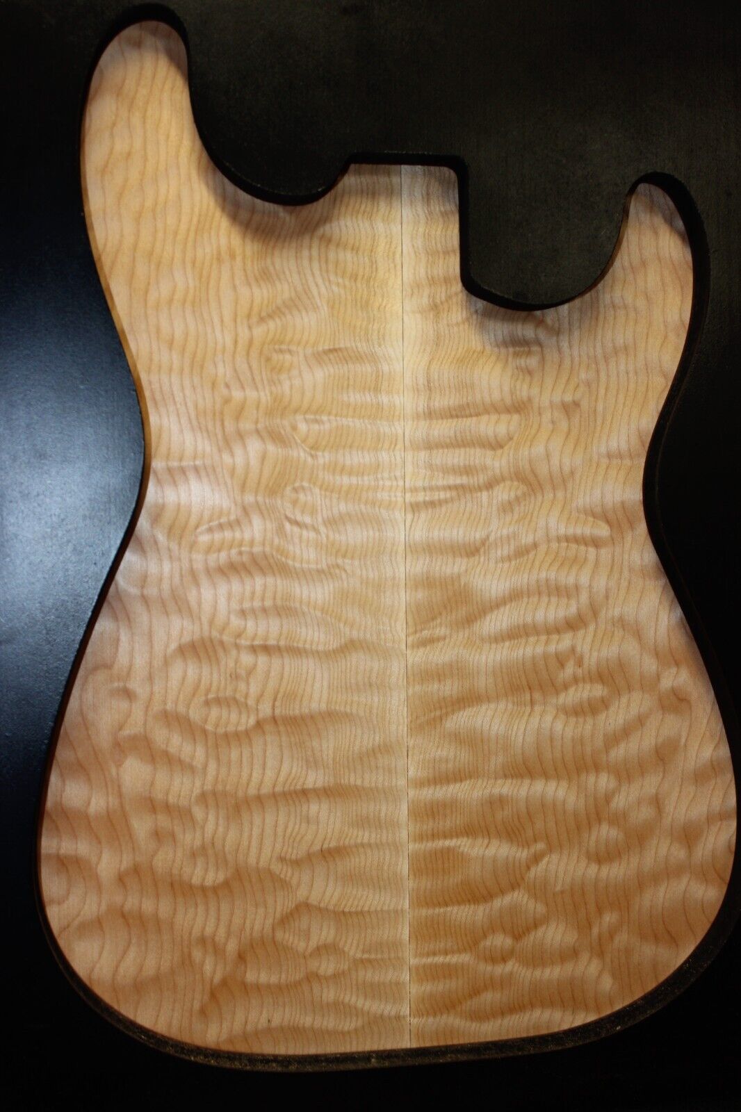 Quilted maple book matched guitar drop top.