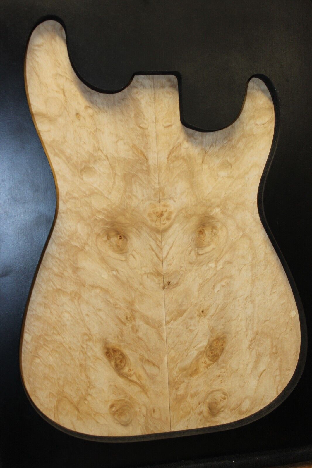 Silver maple, burl / lace figured guitar book matched top.