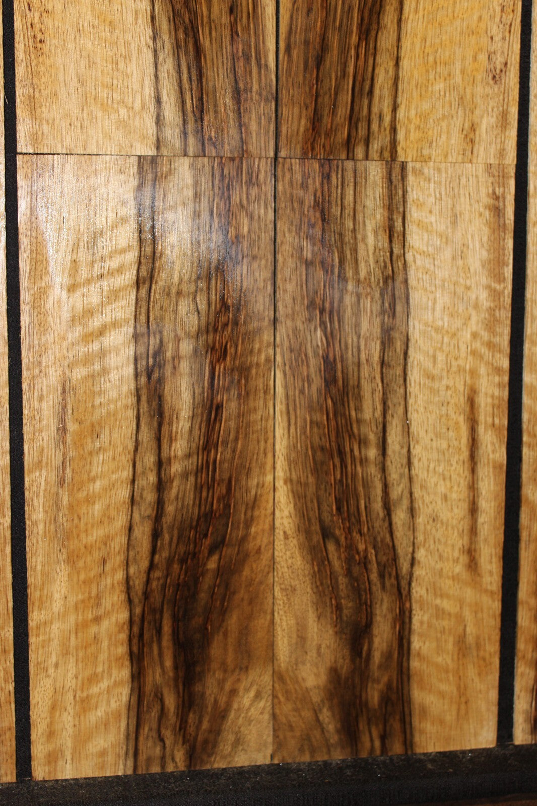 Quarter sawn figured black limba ukulele back, top and side set. Tenor size