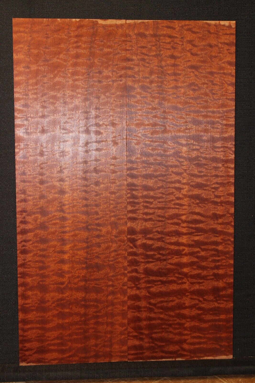 Quilted figured sapele guitar bookmatched drop top.