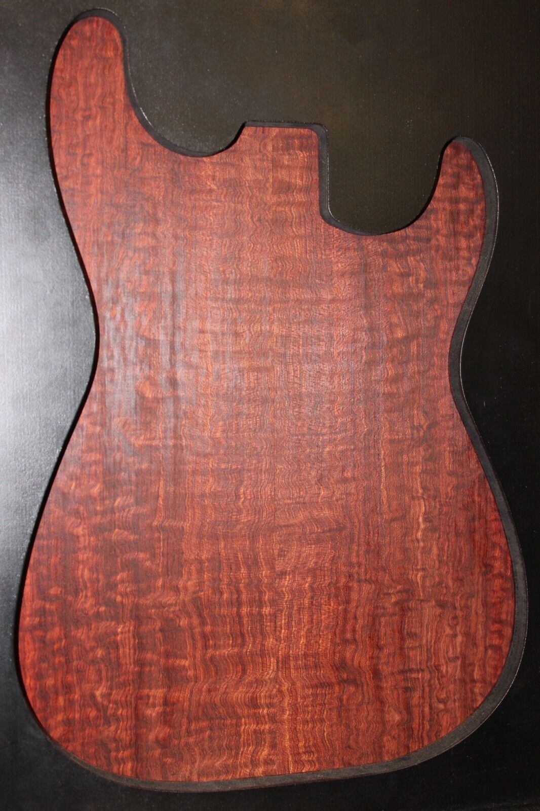 Figured bubinga electric guitar drop top. Curly / pomelle figure & rich color.