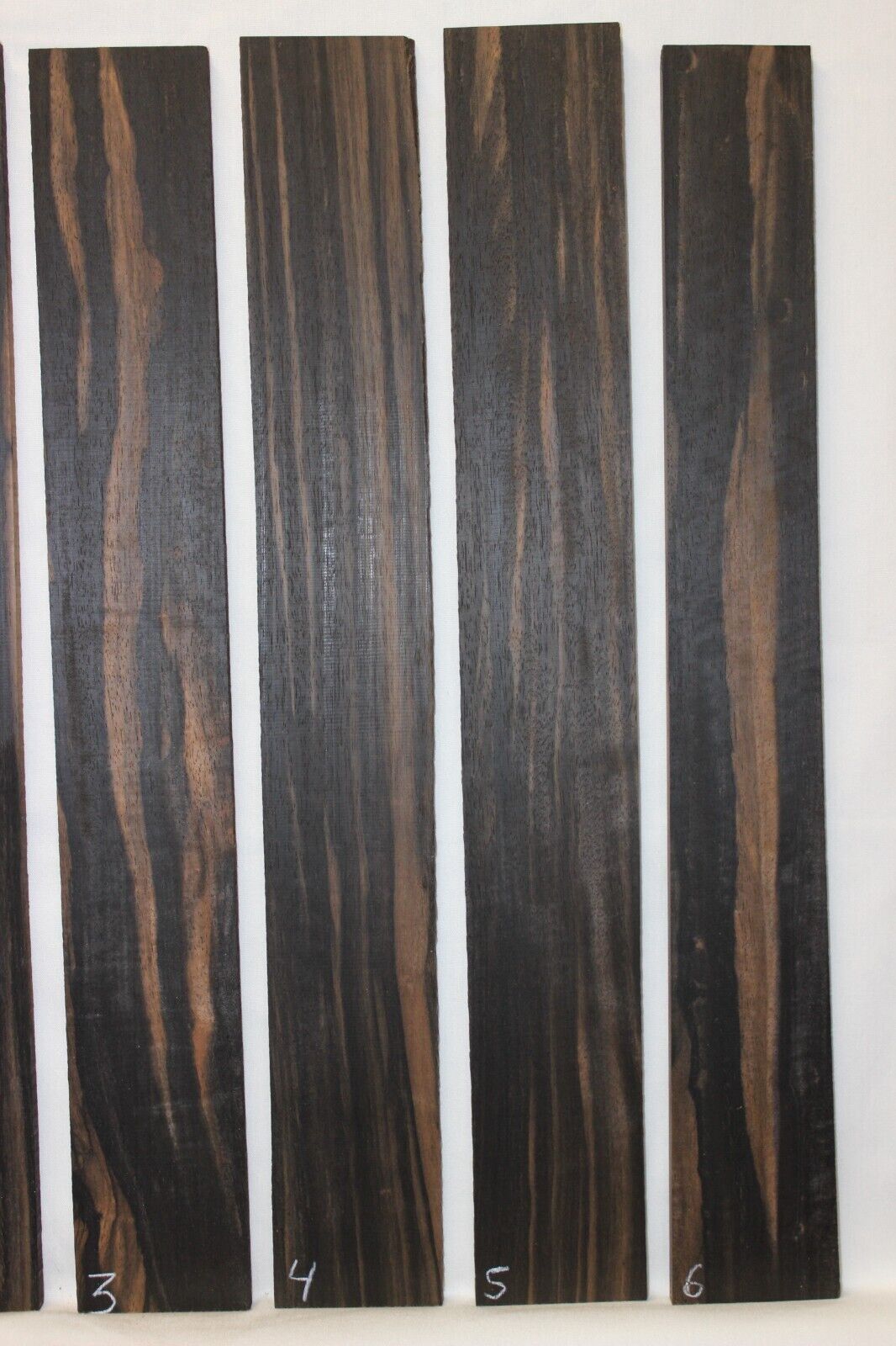 Gaboon ebony guitar fingerboard blanks. Wild color, pale moon ebony like look.