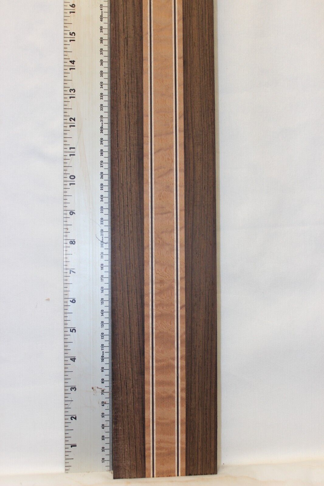 Quilted sapele, wenge and flame maple laminated guitar neck blank.