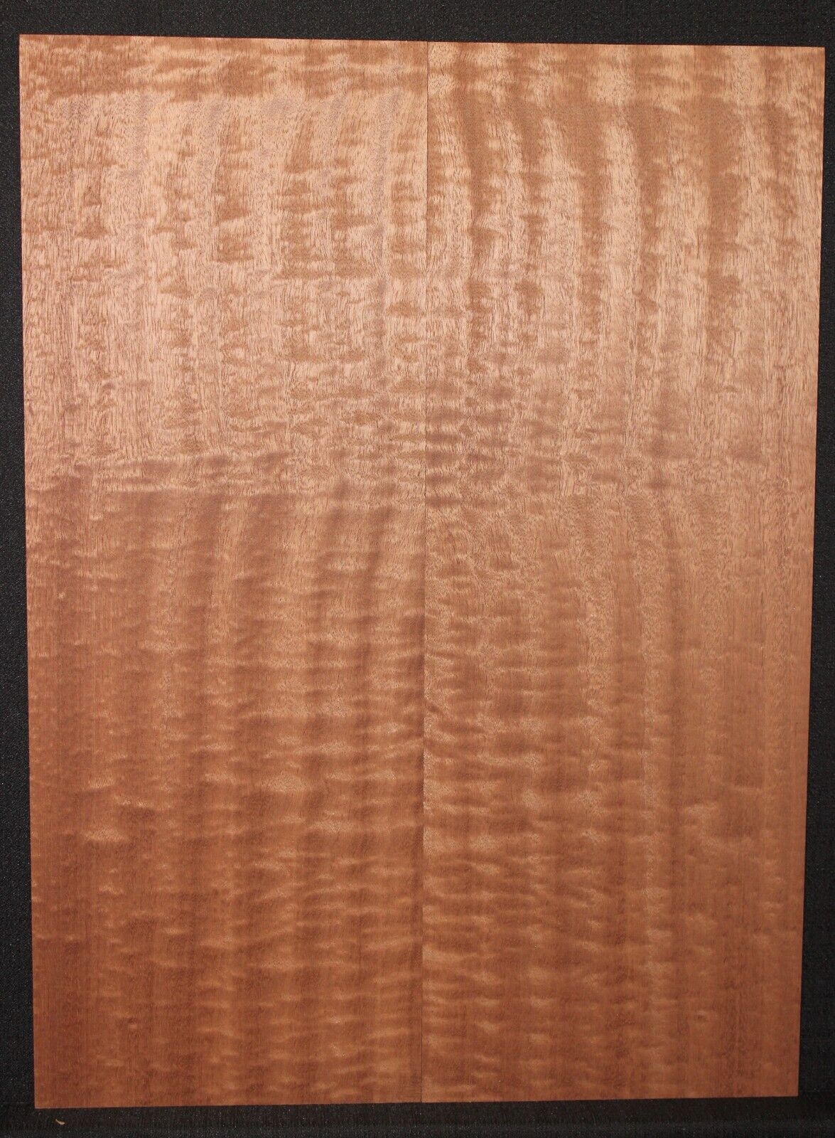 Quilted figured sapele guitar bookmatched drop top.