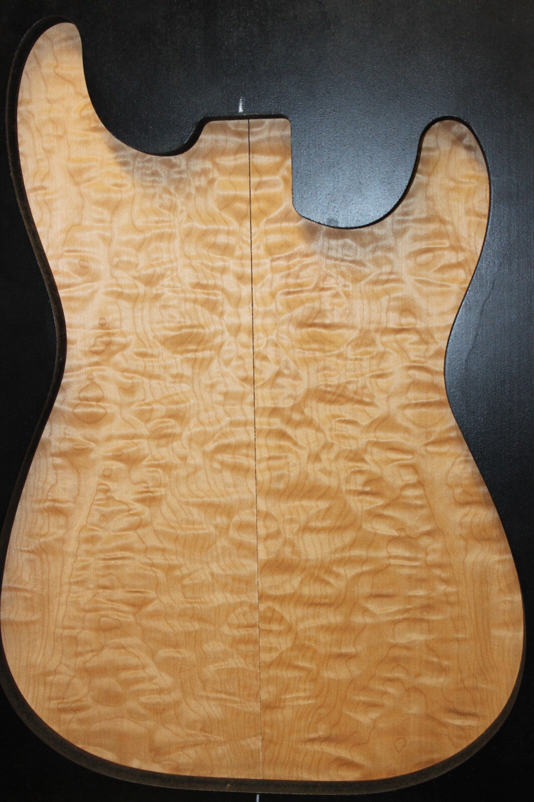 Quilted maple book matched guitar drop top.