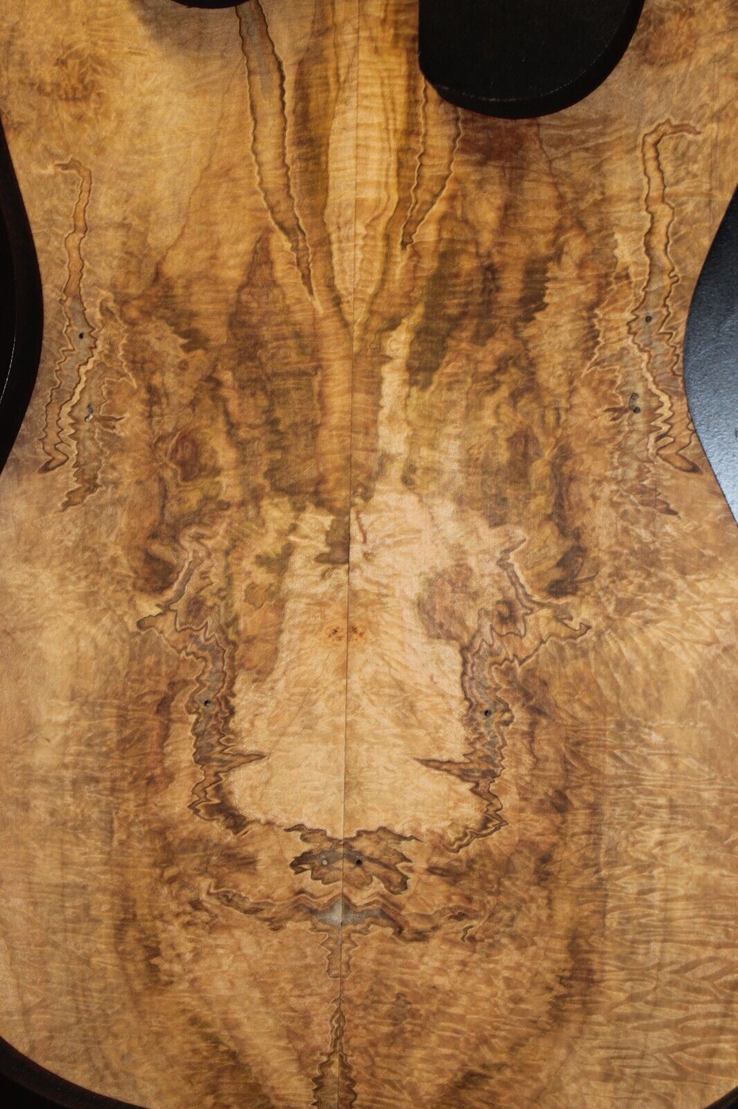 Figured ambrosia maple bookmatched guitar top, insane figure and color.