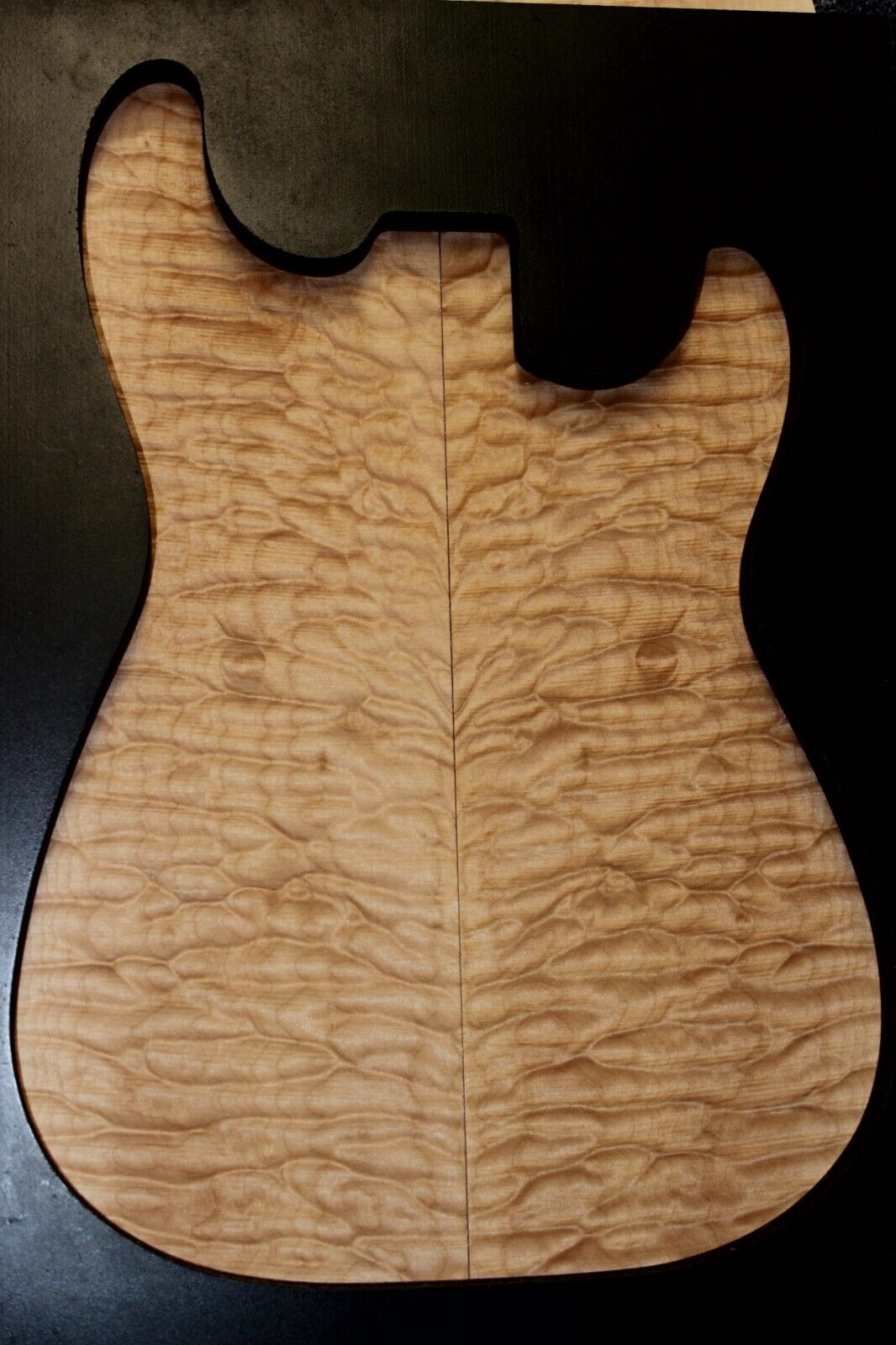 Quilted maple book matched guitar drop top. 5A figure