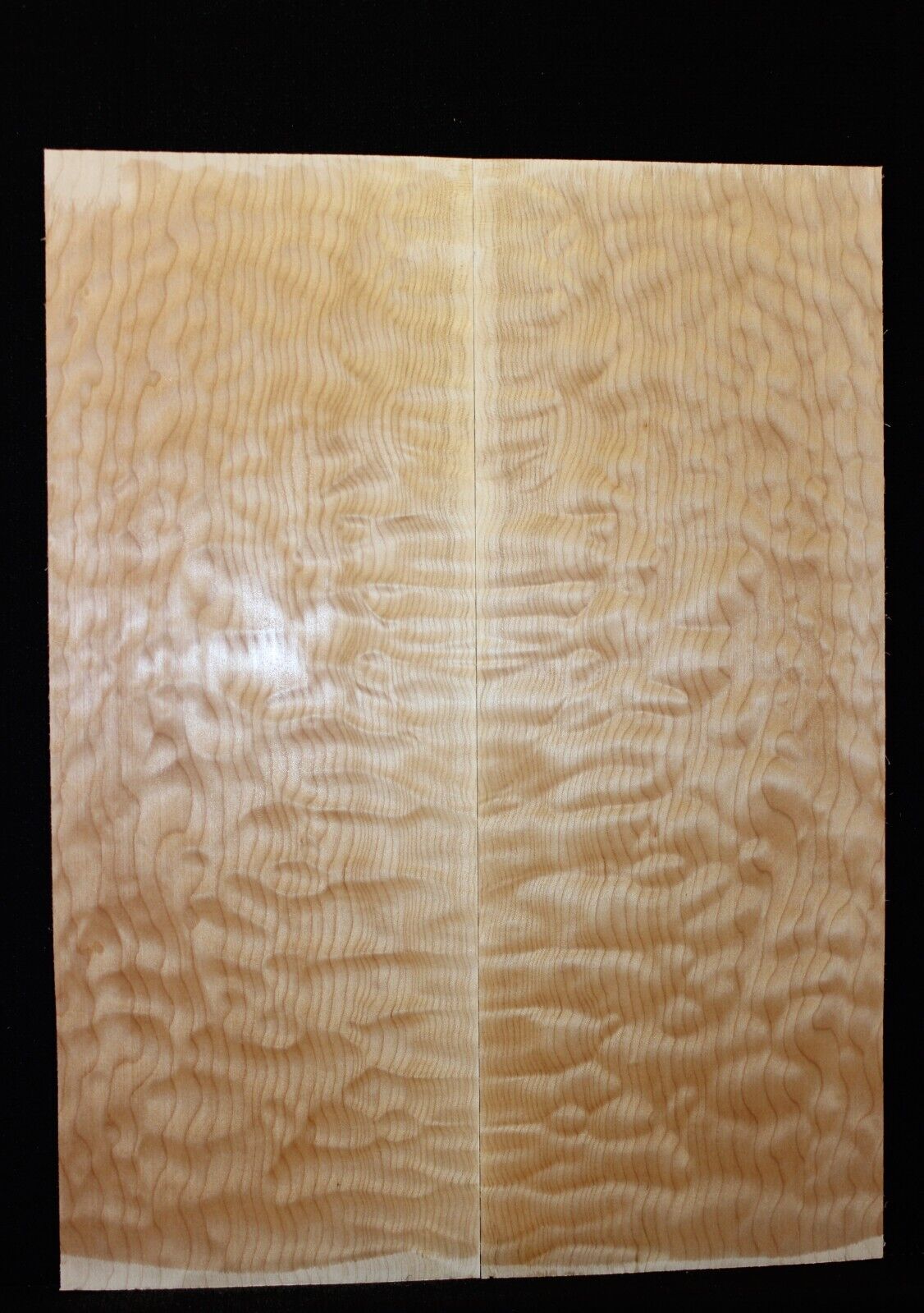Quilted maple book matched guitar drop top.
