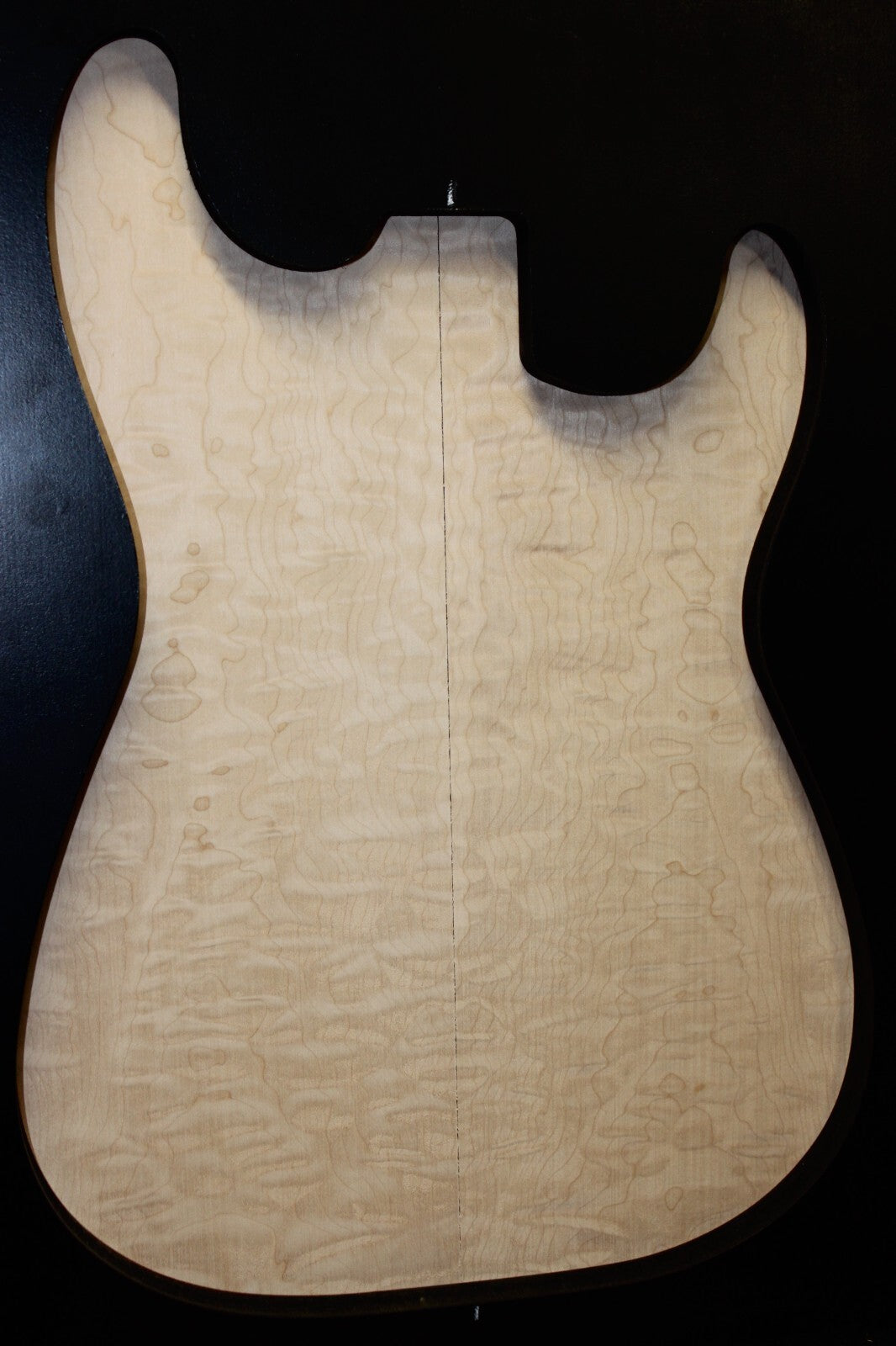 Quilted maple book matched guitar drop top.