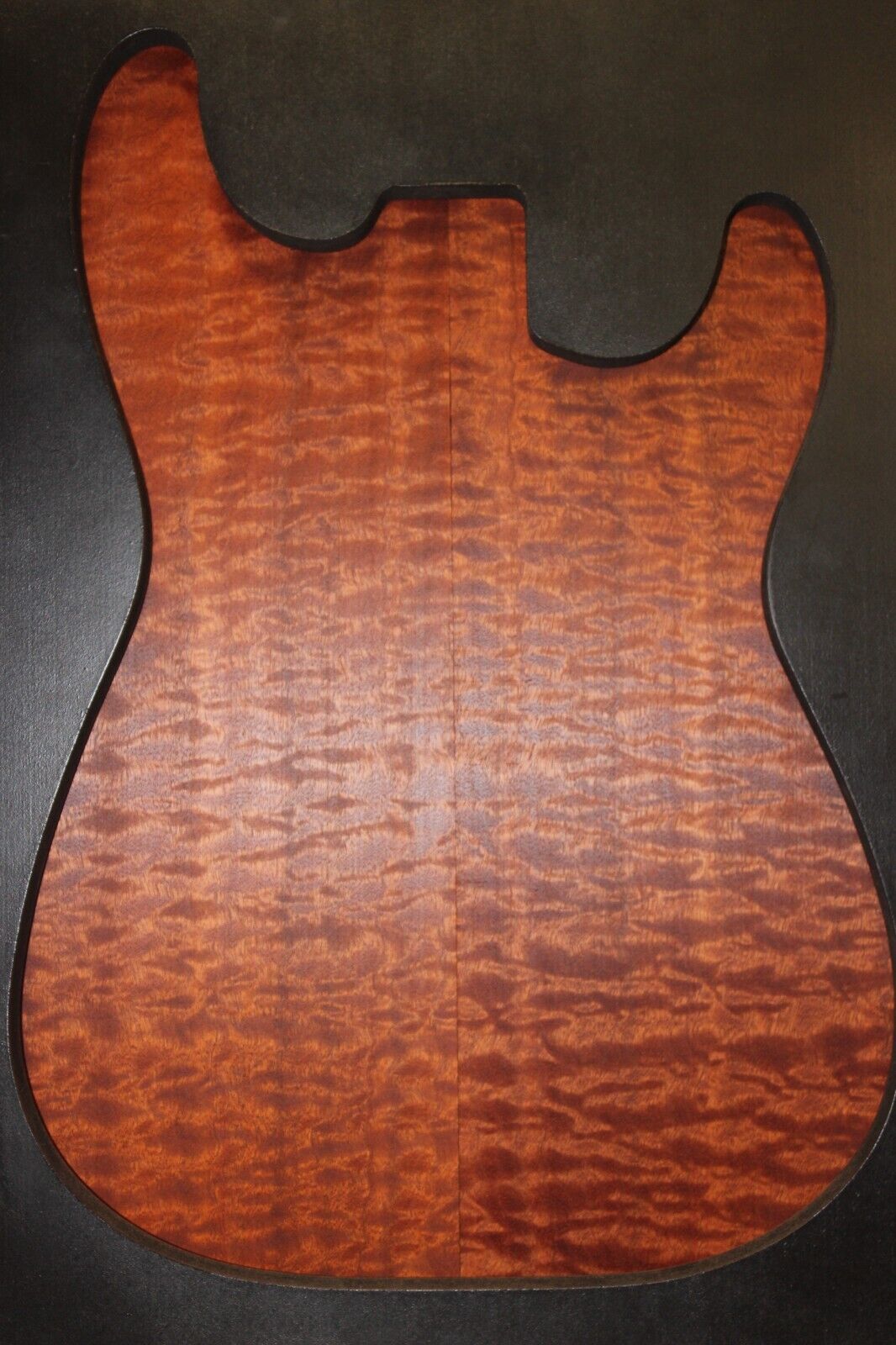 Quilted figured sapele guitar bookmatched drop top.
