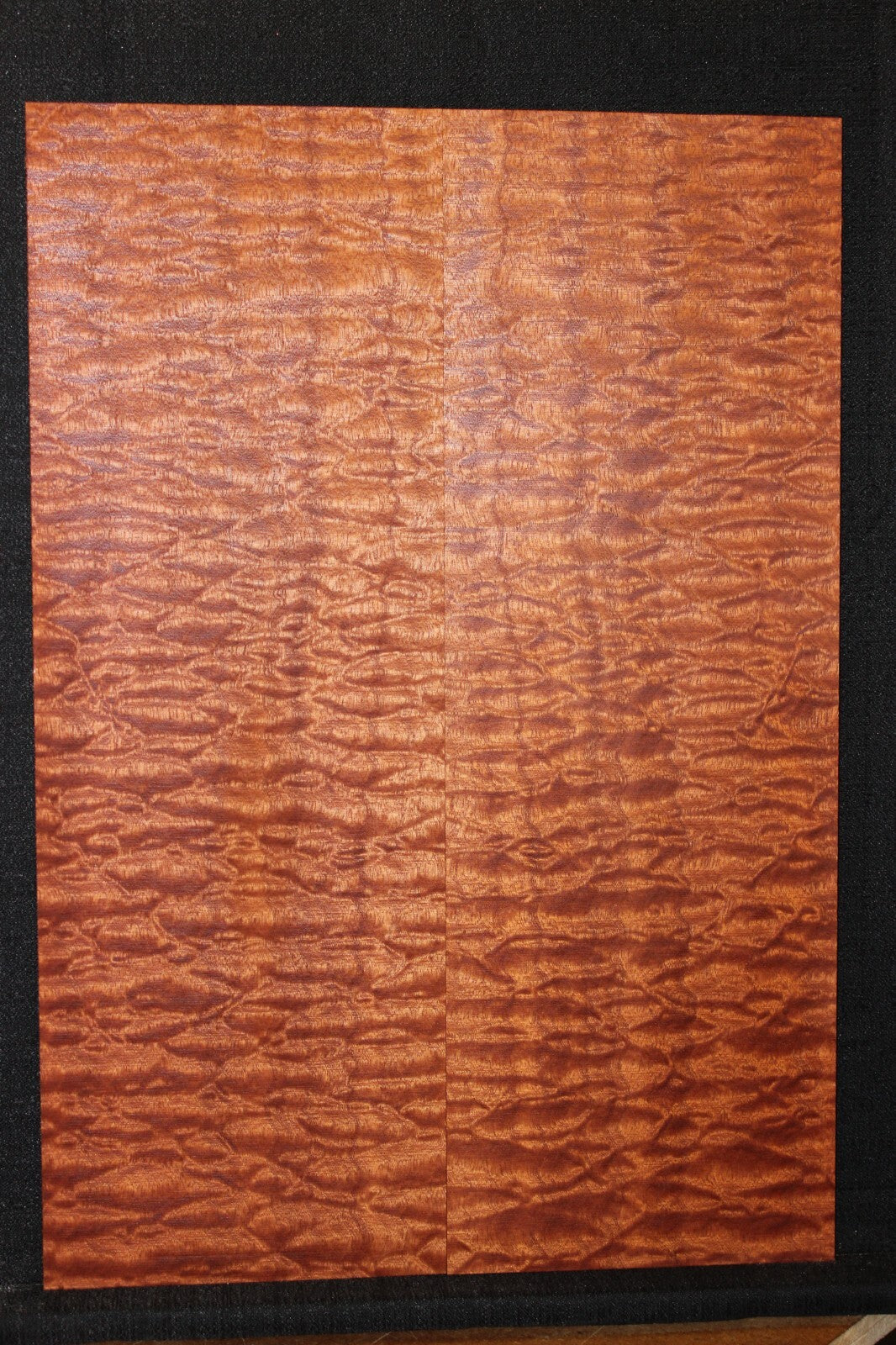 Quilted sapele electric guitar bookmatched drop top. Master grade figure.