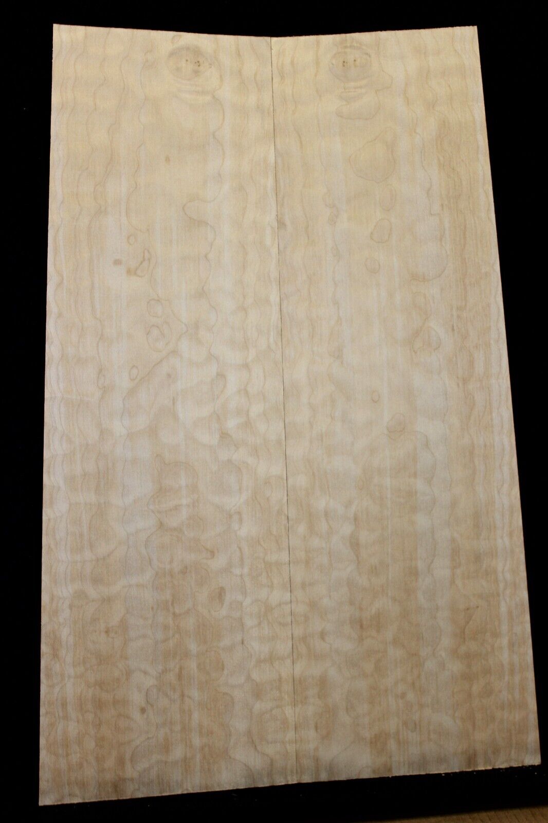 Quilted maple book matched guitar drop top.