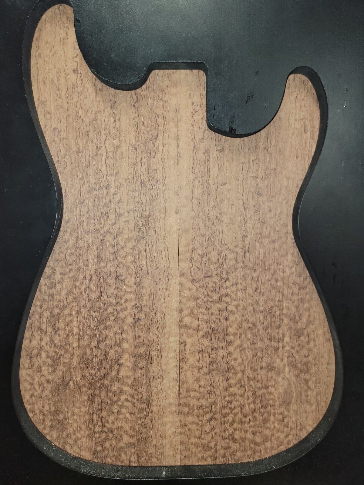Pomelle figured bubinga electric guitar drop top.