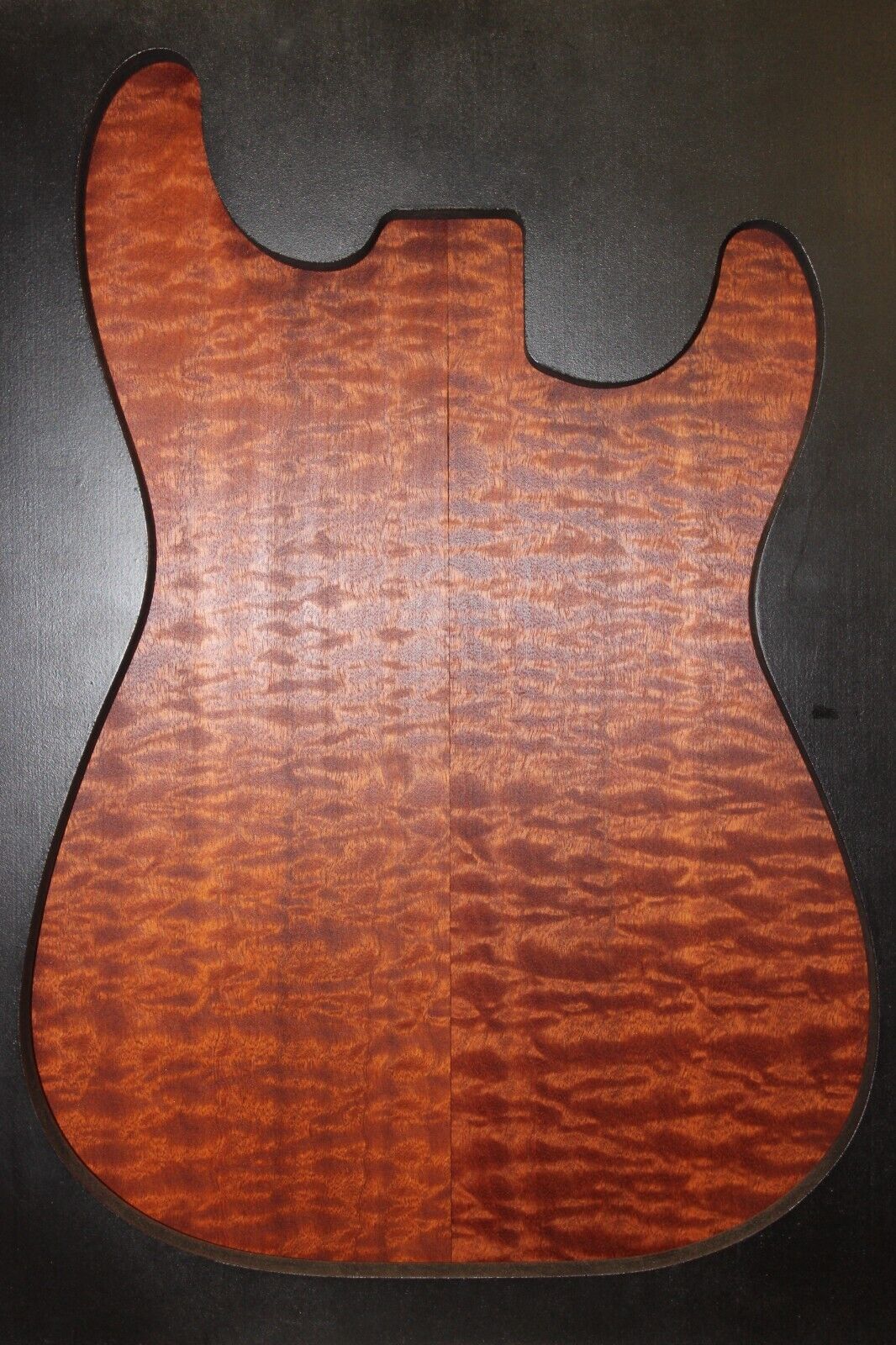 Quilted figured sapele guitar bookmatched drop top.