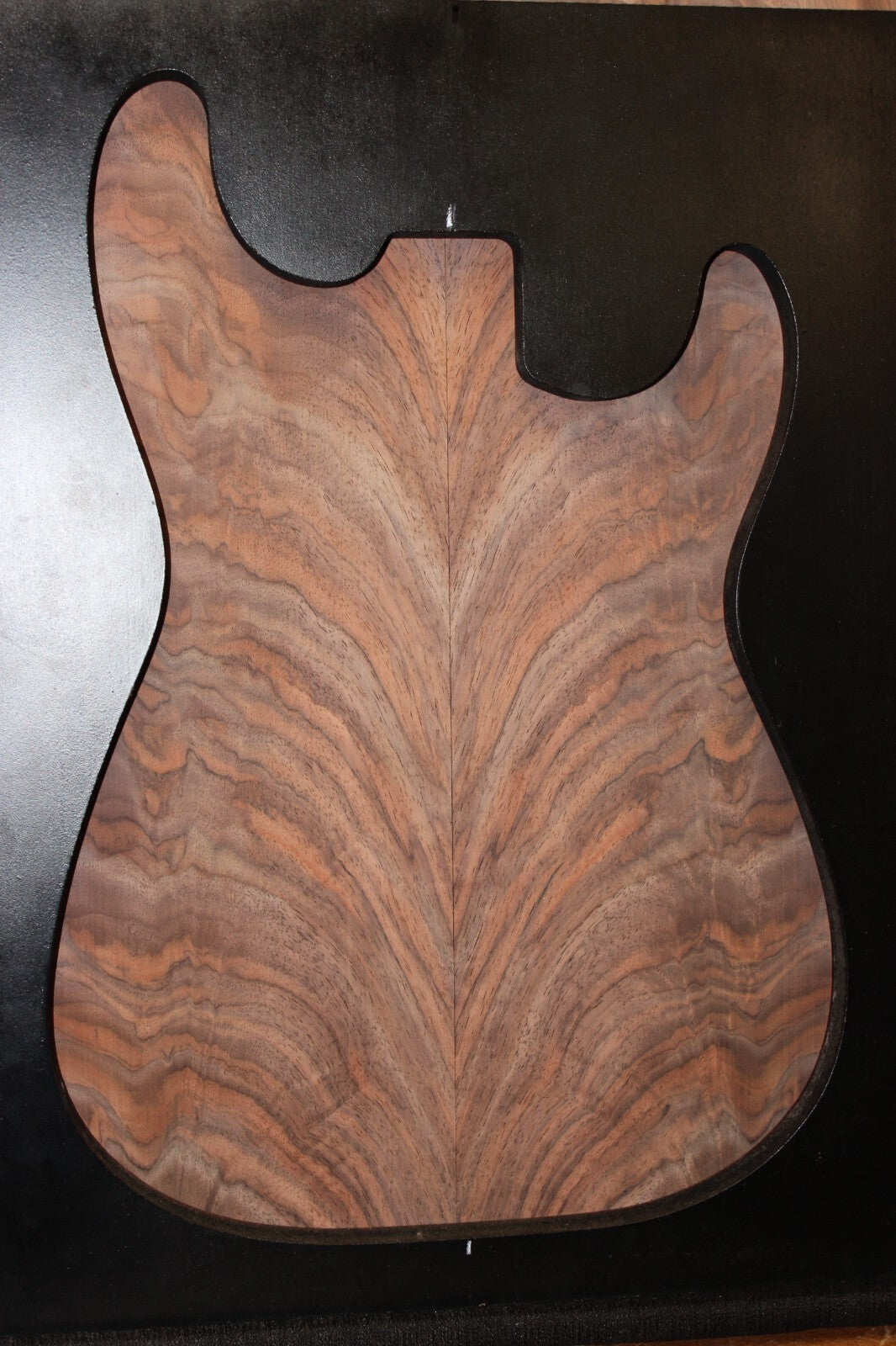 Black walnut crotch figured book matched guitar top.