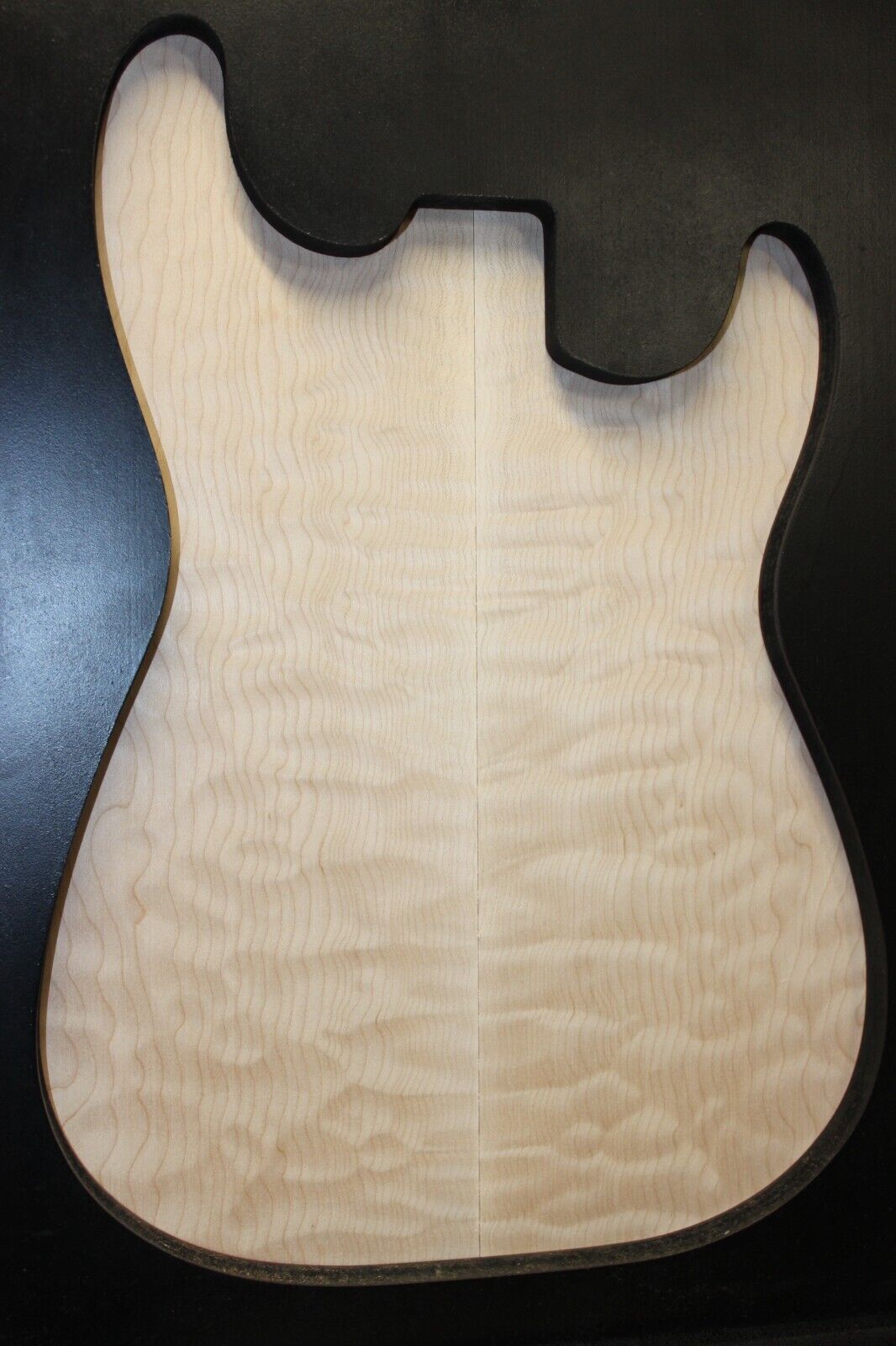 Quilted maple book matched guitar drop top.